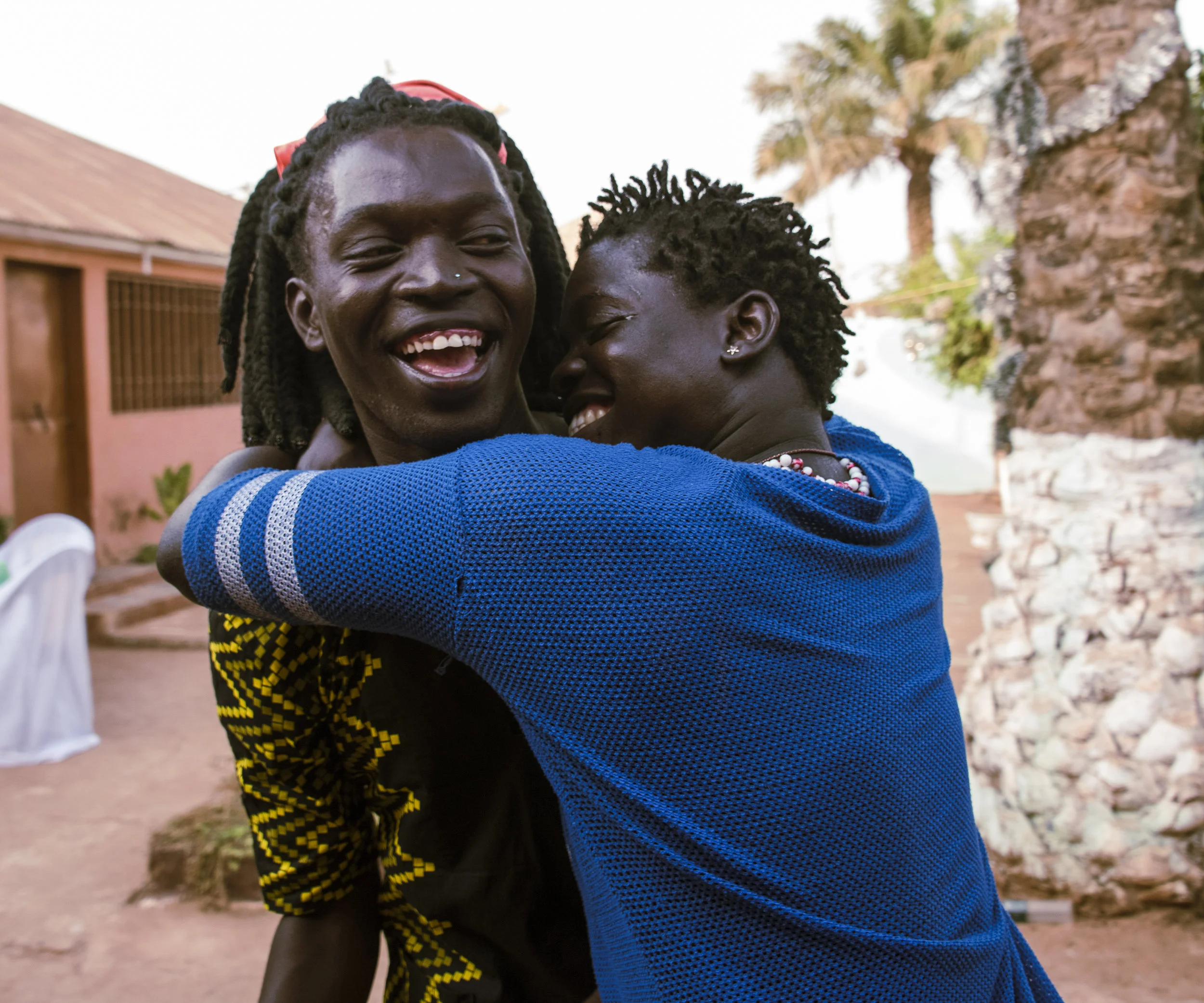 Bissau, Guinea Bissau (February 16, 2018) - Va jokes with Ivan as they prepare for her birthday party.