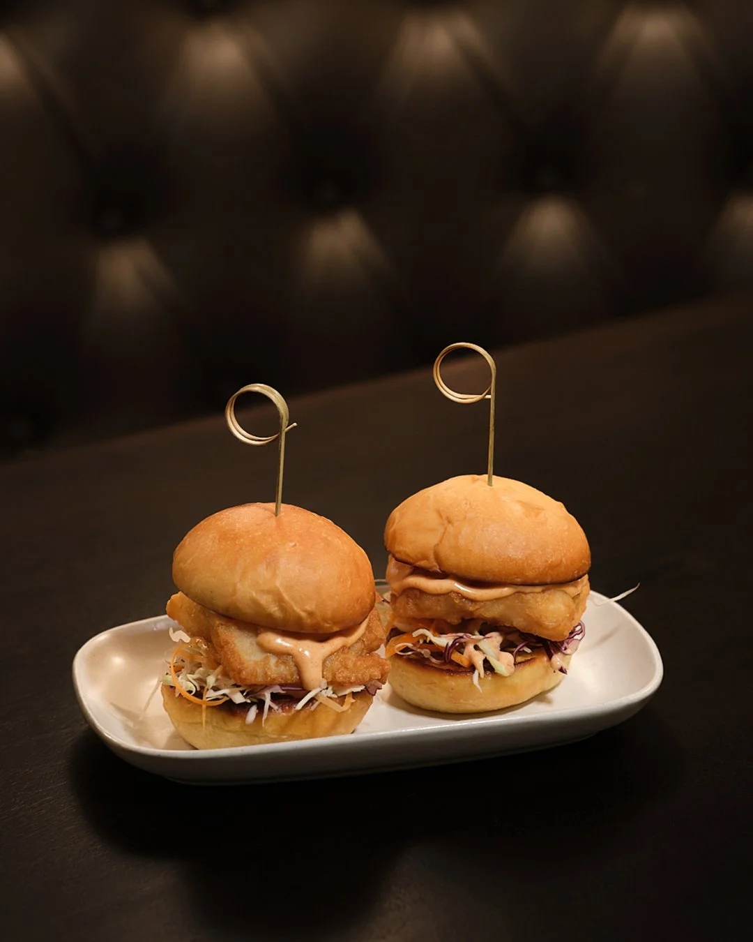 Small plates. Big flavours. 
The Fish Burger sliders, made for sharing. 🍔
Come for the drinks. Stay for this. 
Reserve - link in bio.
