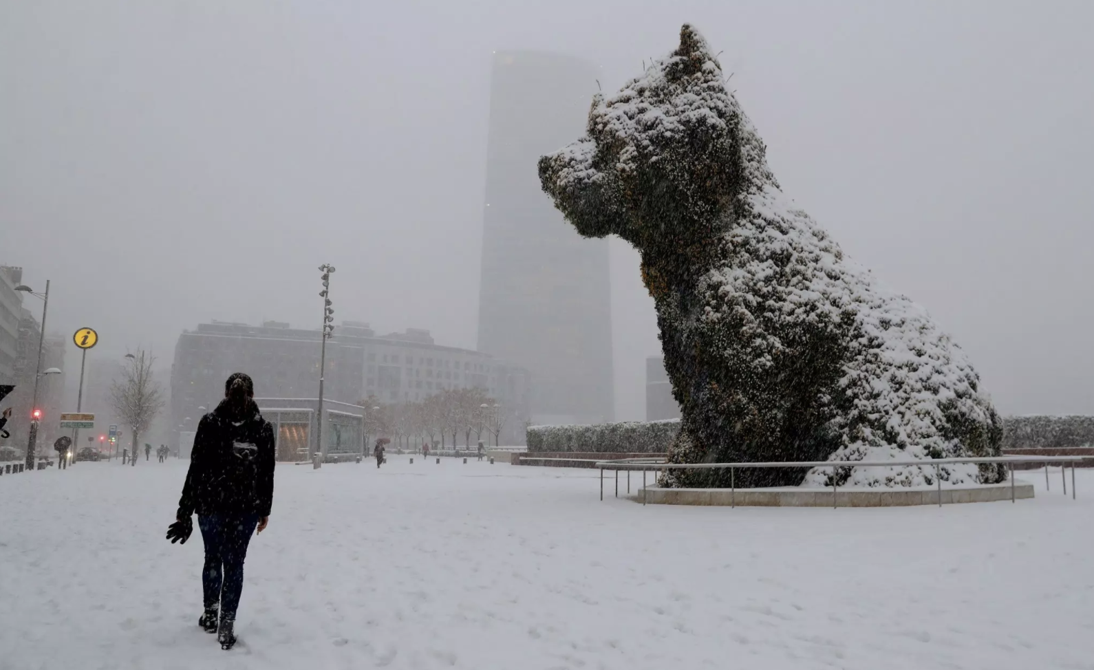A puppy sculpture by Jeff Koons was covered with snow in Bilbao, Spain. CreditLuis Tejido/European Pressphoto Agency