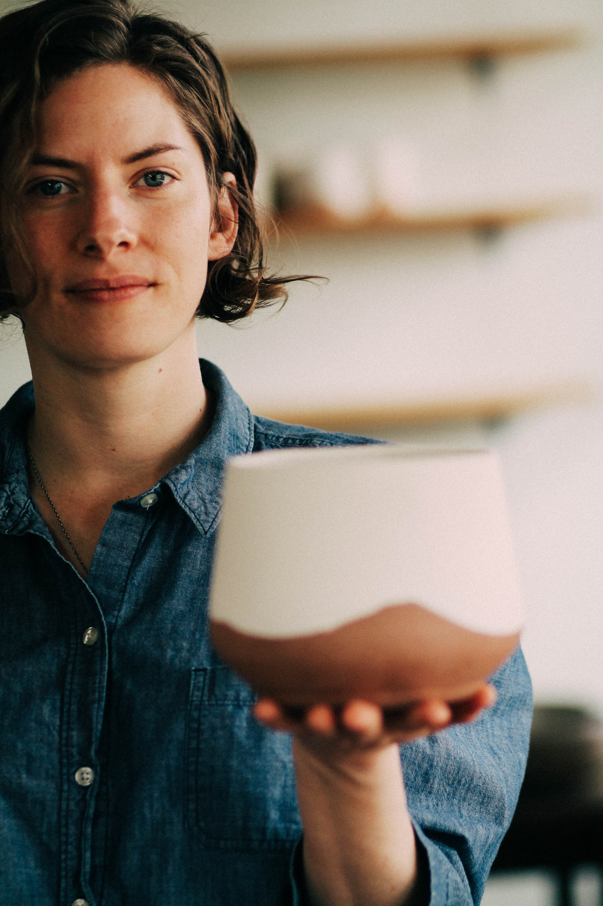 liz kelly holding one of her creations. photo by Elena Caron.