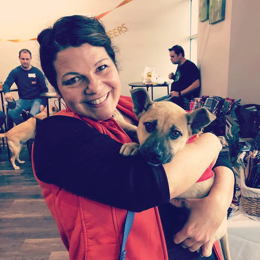 Owner Lesley White with Paw Prints adoptable puppy, Brewster (who got adopted from the event!).