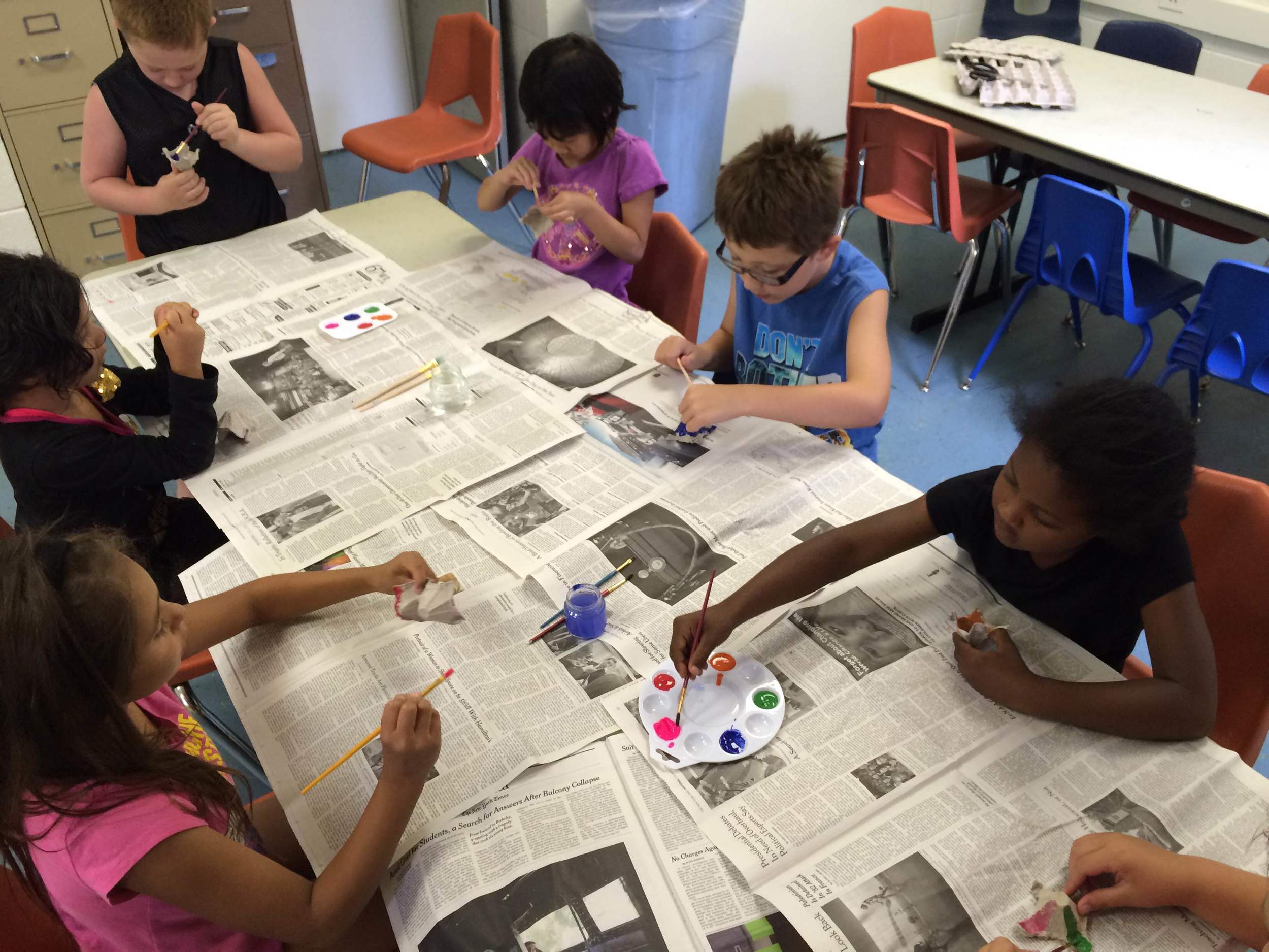 The children spent one of their first lessons decorating and personalizing their egg carton pots
