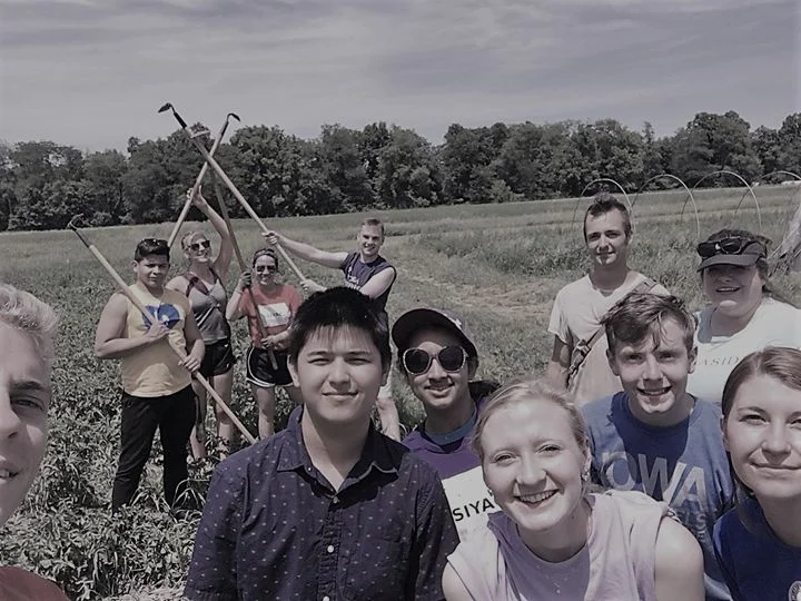 Brianne and members of SIYAC helping harvest food for local communities around Iowa for Feed Iowa First.