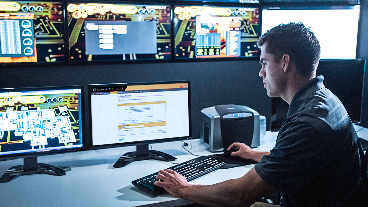 alertus_console_command_security_guard_watching_monitors_in_control_room_1200x678_web.jpg