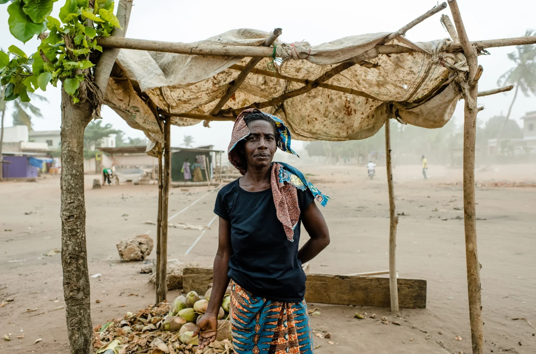 Amelepe Mawuto Using her first loan to start a coconut selling business in Lome, Togo. "With my first loan I bought 100 coconuts for £26. It's just the start"