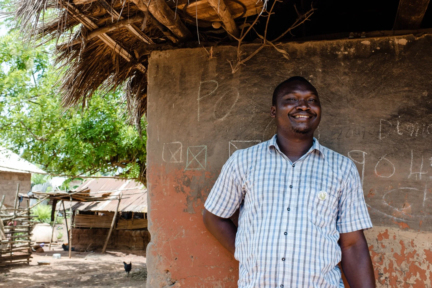 Christian Kadangah Executive Director of IADES, explaining what a loan can mean to one of its 3,000 women members.
