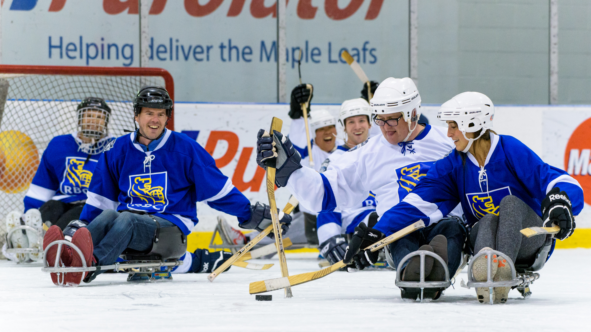 Check out the Sledge Hockey Experience (link below) to see how your company can take part!