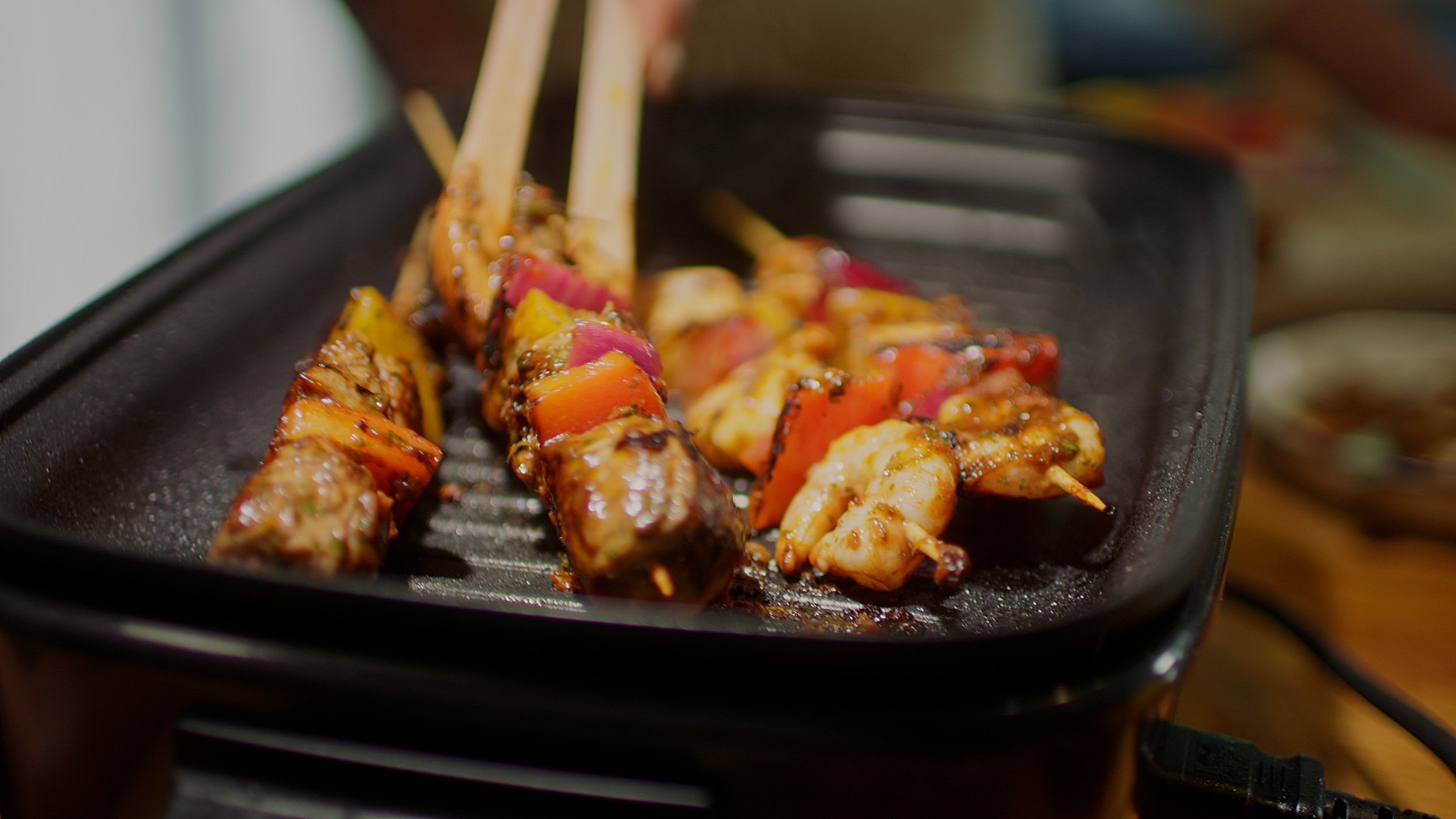  Lamb and pepper skewers sizzling away on the Cook In 