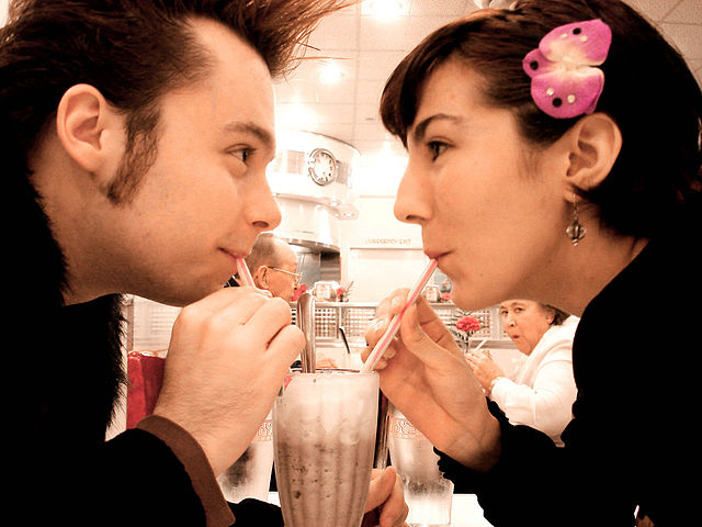 If you search Wikimedia Commons for 'sharing' the most interesting results will involve milkshakes. This one is here.