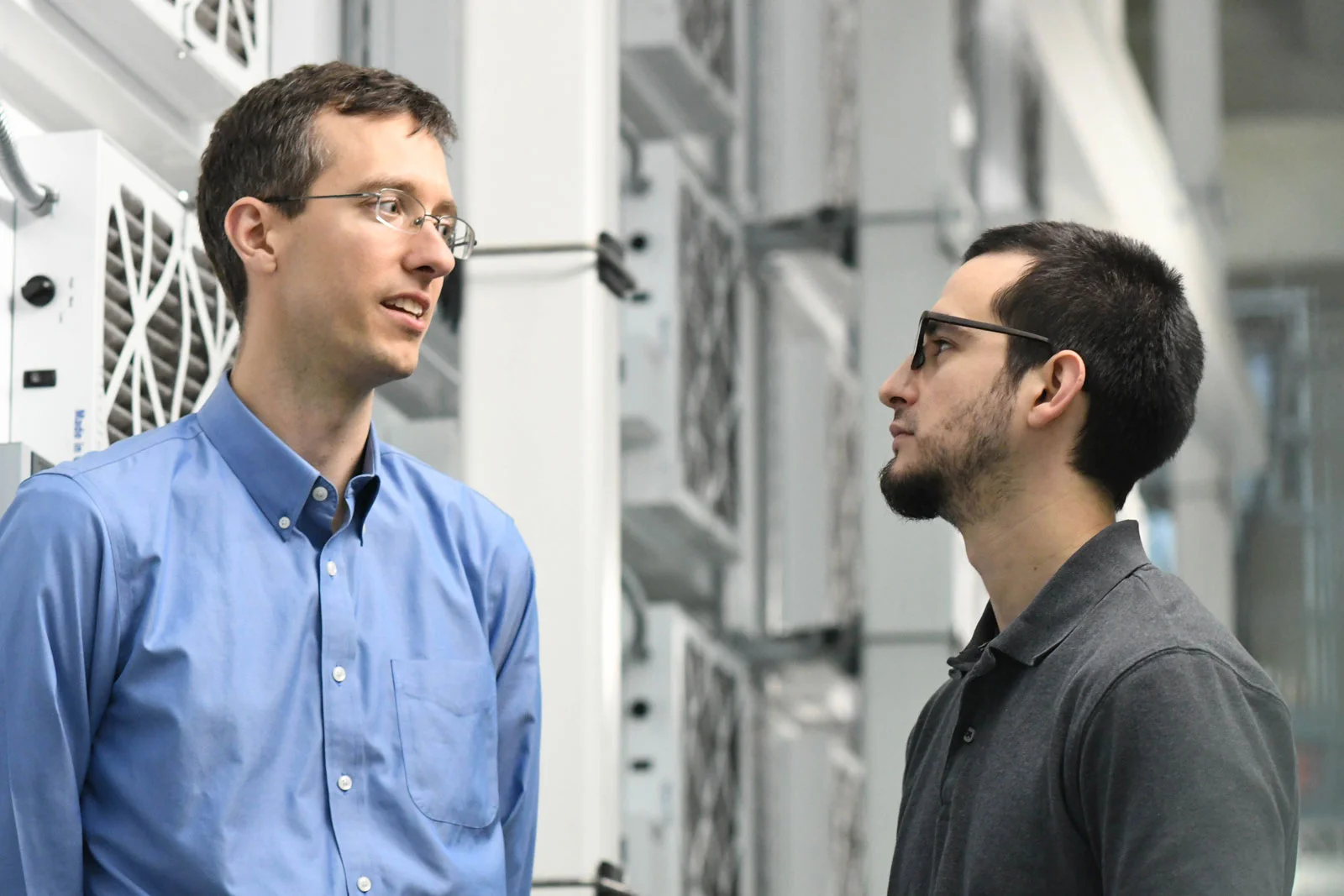 U.S. Naval Research Laboratory Aerospace engineers Evan Ward (left) and Greg Carbott (right). NRL Photo by Emanuel Cavallaro.