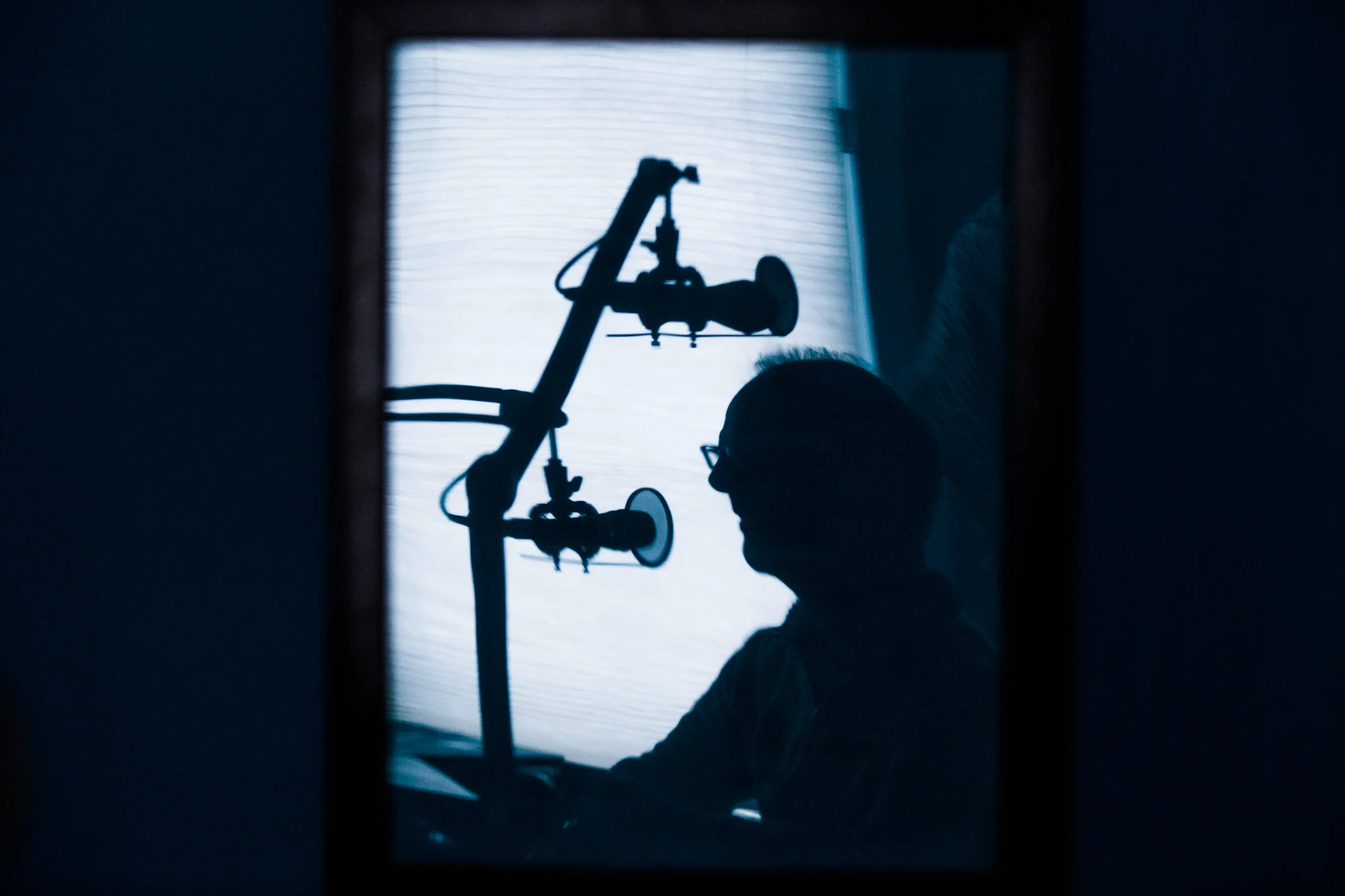 Mark poses for an anonymous illustration of his process recording the podcast. | Photo by Brittany Greeson