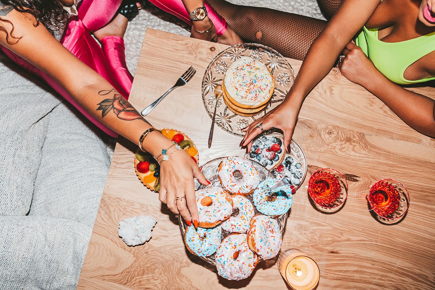 two-girls-reaching-for-donuts.jpg