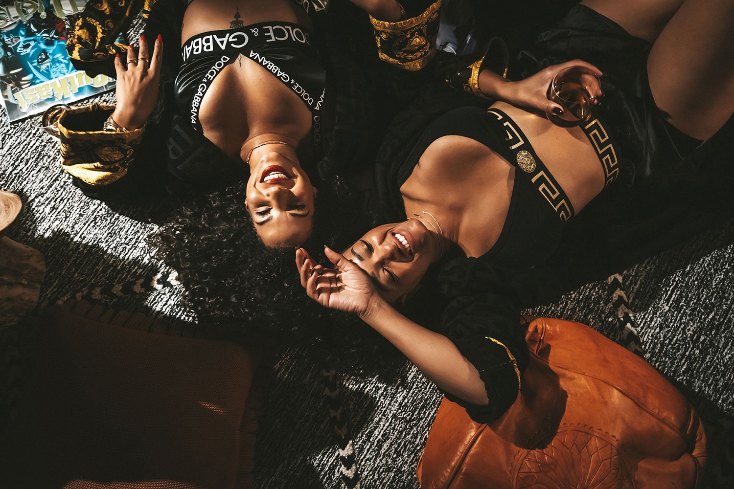 two-woman-lounging-in-versace-moody-room.jpg
