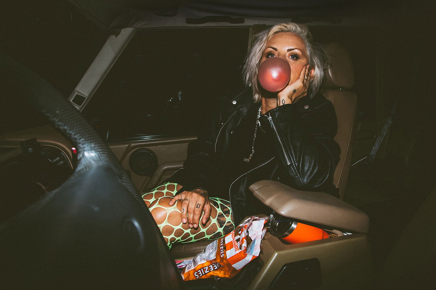 woman-in-car-blowing-bubble.jpg