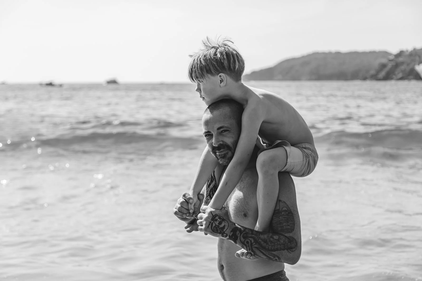 coquitlam-bc-family-photography-dad-and-son-hugging-at-beach.jpg