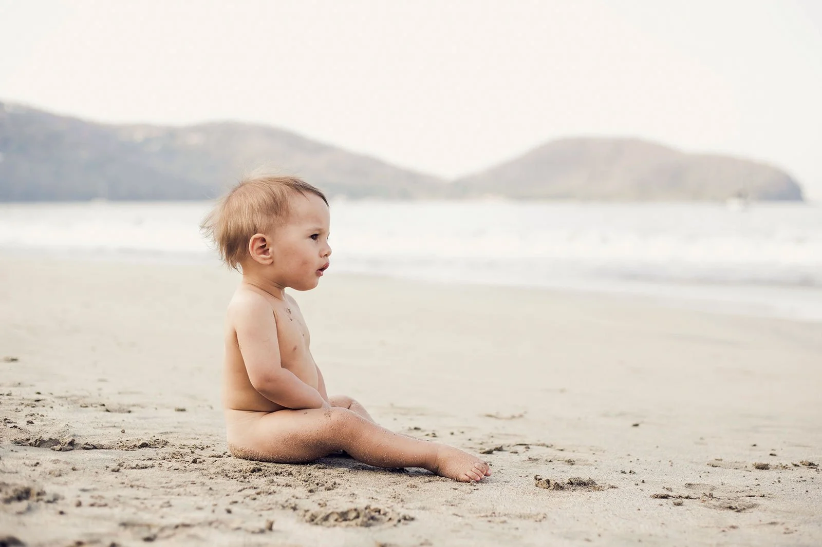 tri-cities-bc-family-photographer-kid-sitting-in-sand-travel.jpg