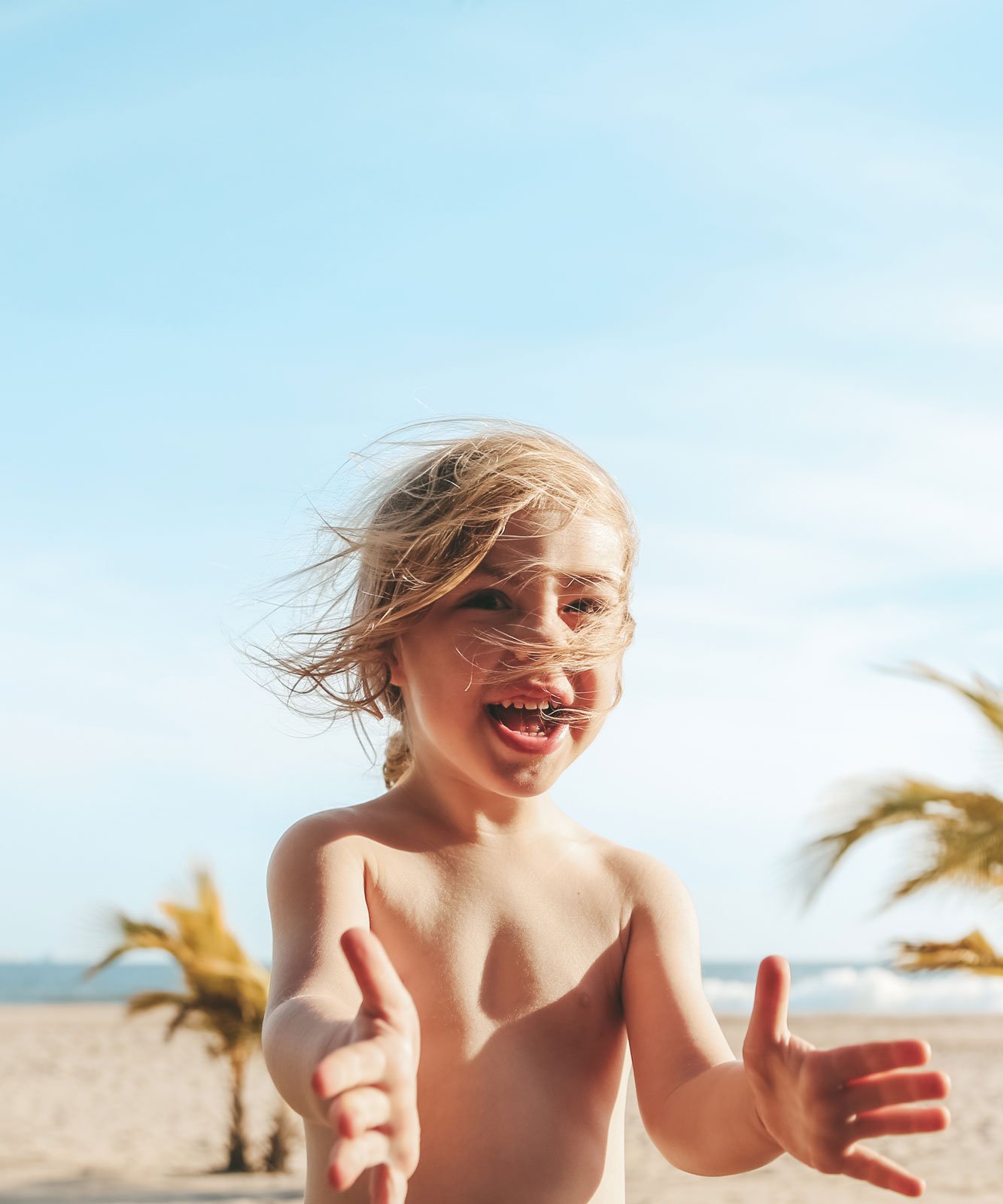 tri-cities-bc-family-travel-photographer-beach-kid-laughing.jpg