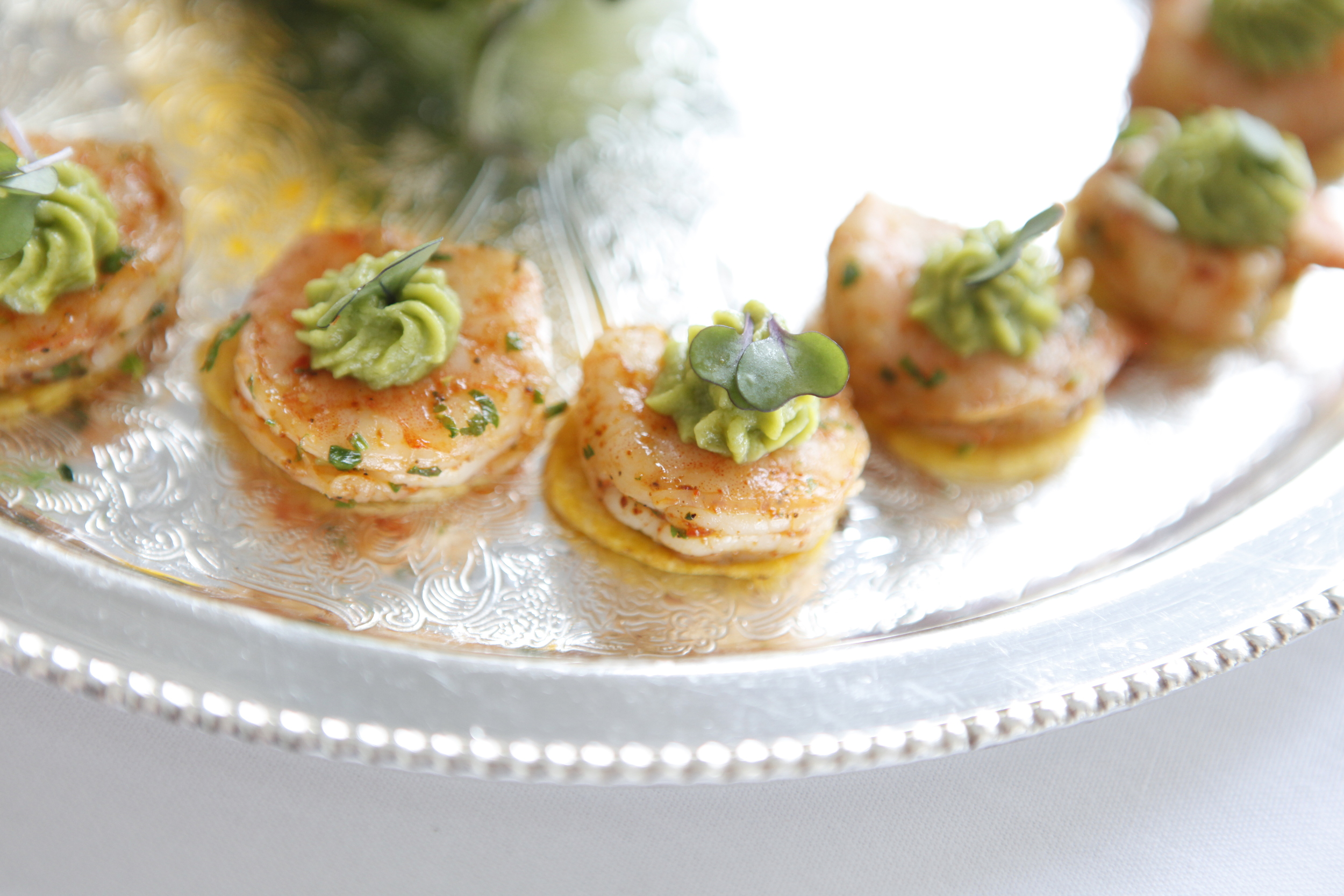 Jamaican Grilled Shrimp with an avocado mousse on a plantain chip