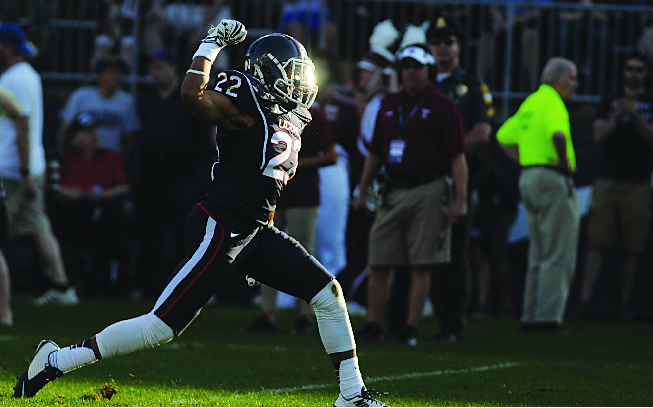UConn safety Andrew Adams celebrates after making a tackle during the Huskies' game against Temple at Rentschler Field in East Hartford, Connecticut on Sept. 27, 2014. Adams led the team with four interceptions last season. (Troy Caldeira/The Daily Campus)