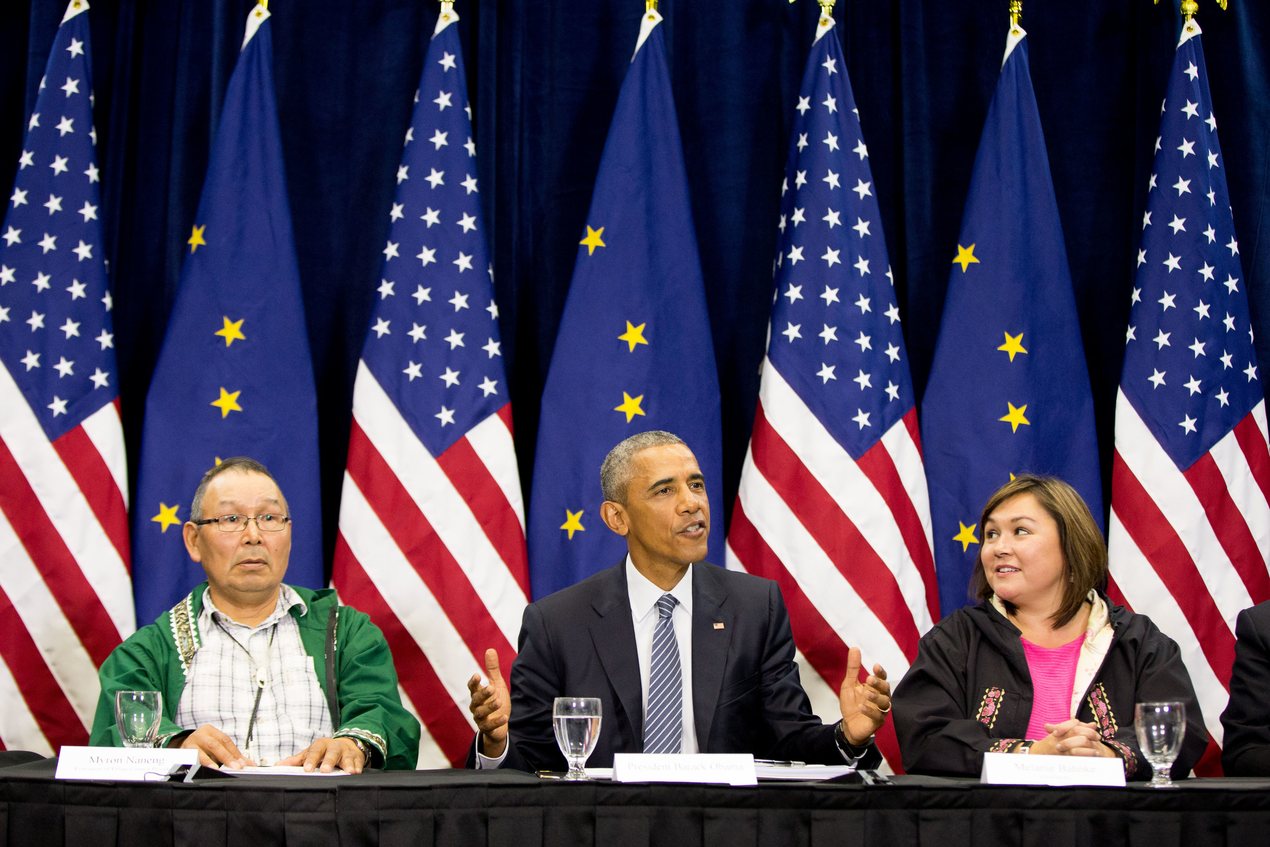 President Barack Obama, center, accompanied by President of the Association of Village Council Presidents Myron Naneng, left, and Kawerak, Inc. President and CEO Melanie Bahnke, right, participates in a roundtable at the Dena’ina Civic and Convention Center, Monday, Aug. 31, 2015, in Anchorage, Alaska. Obama opened a historic three-day trip to Alaska aimed at showing solidarity with a state often overlooked by Washington, while using its glorious but changing landscape as an urgent call to action on climate change. (Andrew Harnik/AP)