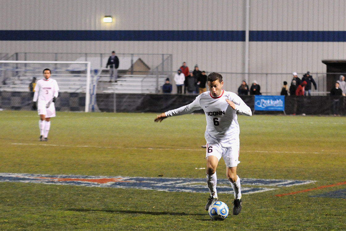 UConn defender Benjamin Wagman dribbles up the field against South Florida during the American Athletic Conference tournament at Joseph J. Morrone Stadium on Nov. 14, 2014. (Amar Batra/The Daily Campus)