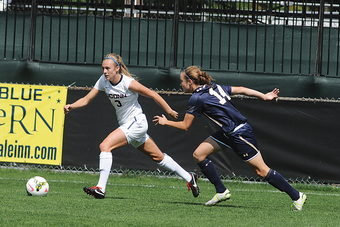 In this file photo, UConn junior forward Rachel Hill dribbles past a Navy player during a women's soccer game at Joseph J. Morrone Stadium in Storrs, Connecticut on Aug. 24, 2014. (File Photo/The Daily Campus)