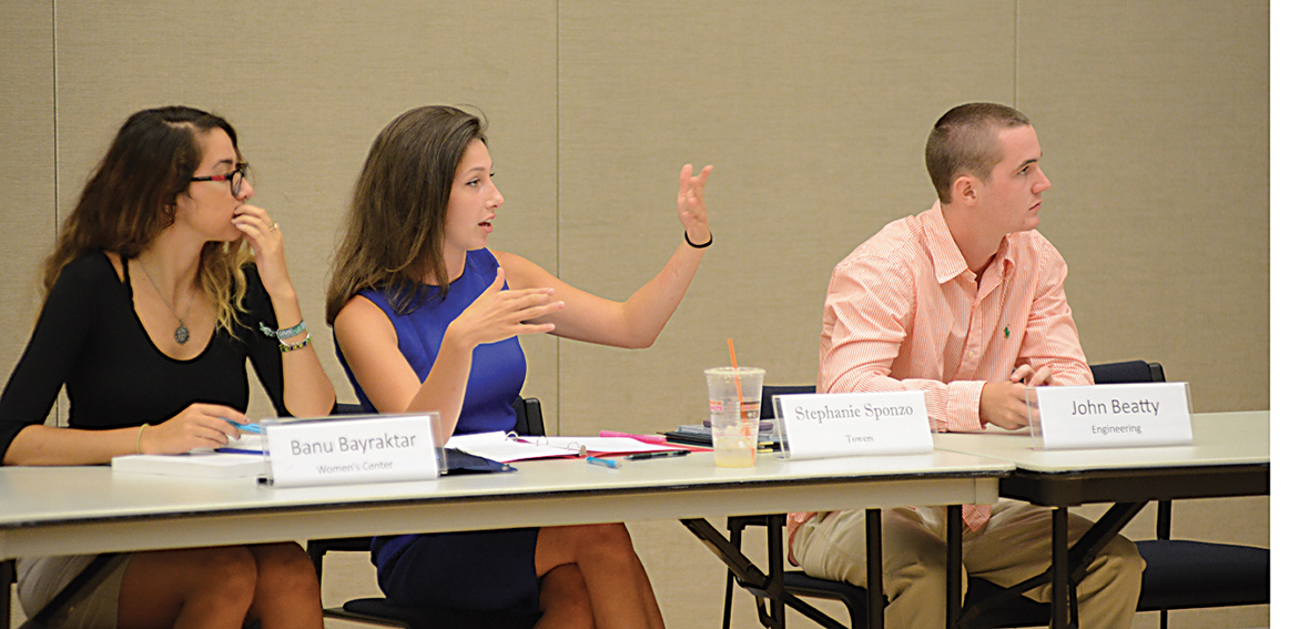 Towers Residence Hall Senator Stephanie Sponzo (center) speaks during the Undergraduate Student Government's first Senate meeting of the year in the UConn Student Union on Sept. 2, 2015. (Jason Jiang/The Daily Campus)