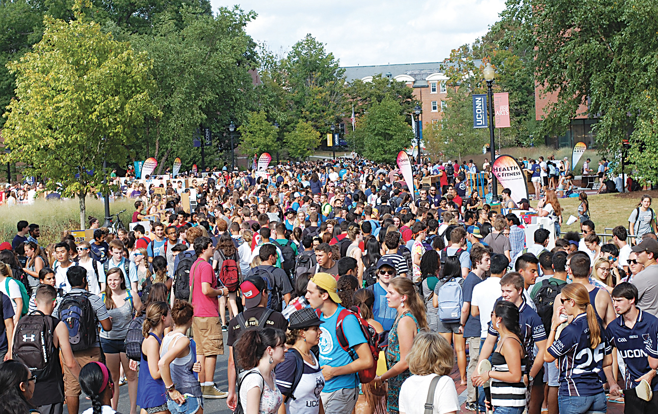 Students walk on Fairfield Way during the fall Involvement Fair on Wednesday, Sept. 9, 2015. New and returning students were welcomed by over 500 clubs and organizations. (Ashley Maher/The Daily Campus)