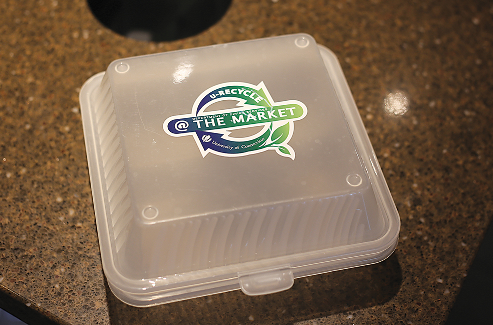 In this photo, a UConn Student Union reusable takeout container is pictured. The containers, made with 100-percent BPA free polypropylene, can then be left in a drop box in the food court to be sanitized for future use. (Jackson Haigis/The Daily Campus)