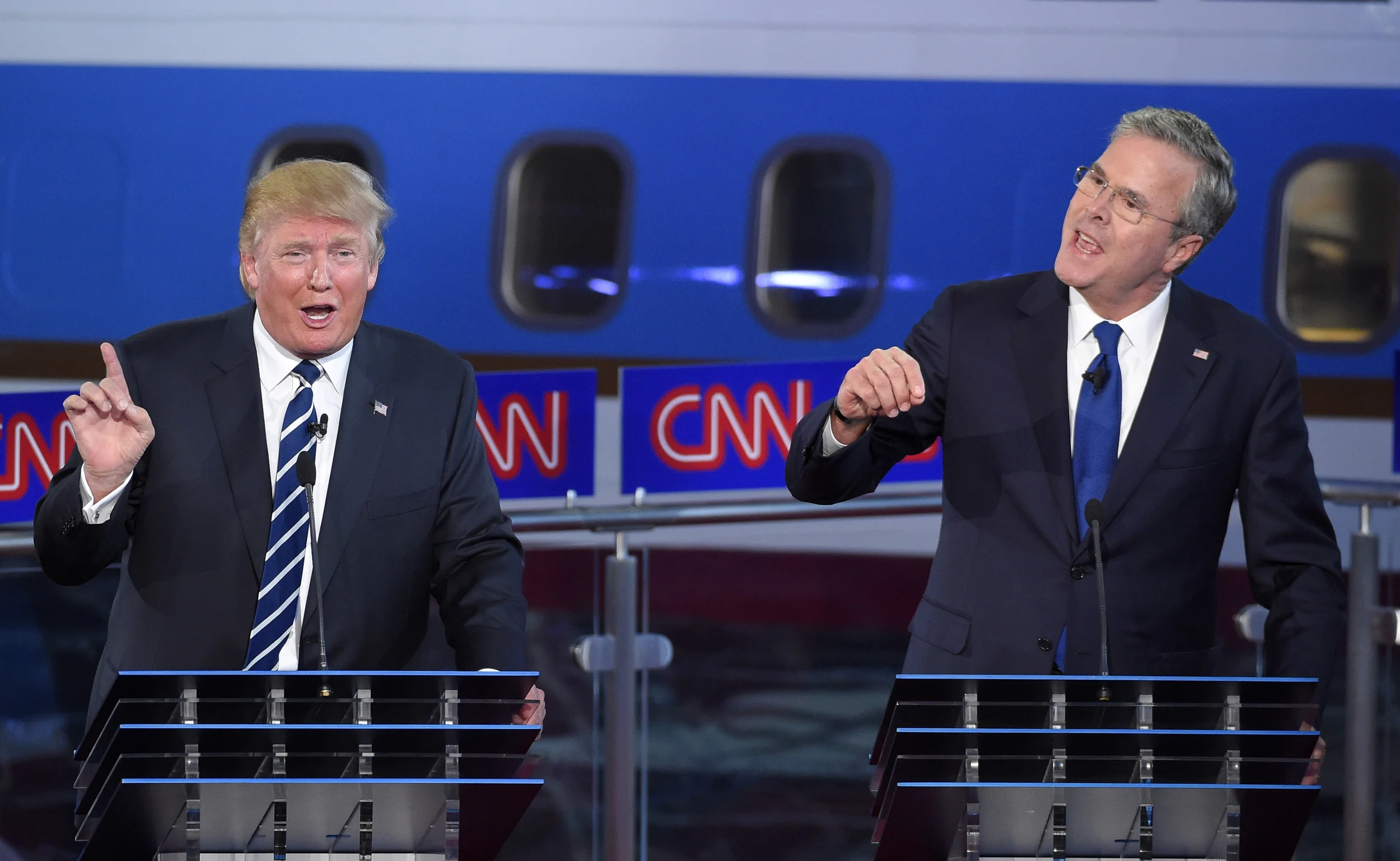 Republican presidential candidates, former Florida Gov. Jeb Bush, right, and Donald Trump both speak during the CNN Republican presidential debate at the Ronald Reagan Presidential Library and Museum on Wednesday, Sept. 16, 2015, in Simi Valley, Calif. (Mark J. Terrill/AP)