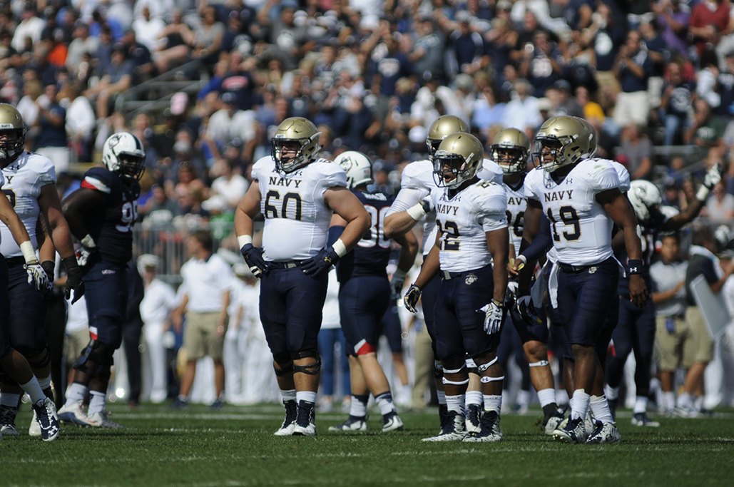 Navy quarterback Keenan Reynolds (19) stands between plays during the Midshipmen's game against UConn at Pratt & Whitney Stadium at Rentschler Field in East Hartford, Connecticut on Saturday, Sept. 26, 2015. (Bailey Wright/The Daily Campus)
