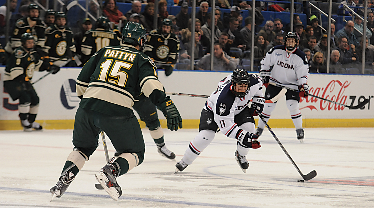 UConn sophomore forward Corey Ronan (11) skates past a Vermont player during the Huskies' game against the Catamounts at XL Center in Hartford, Conn. on Friday, Nov. 21, 2014. (File Photo/The Daily Campus)