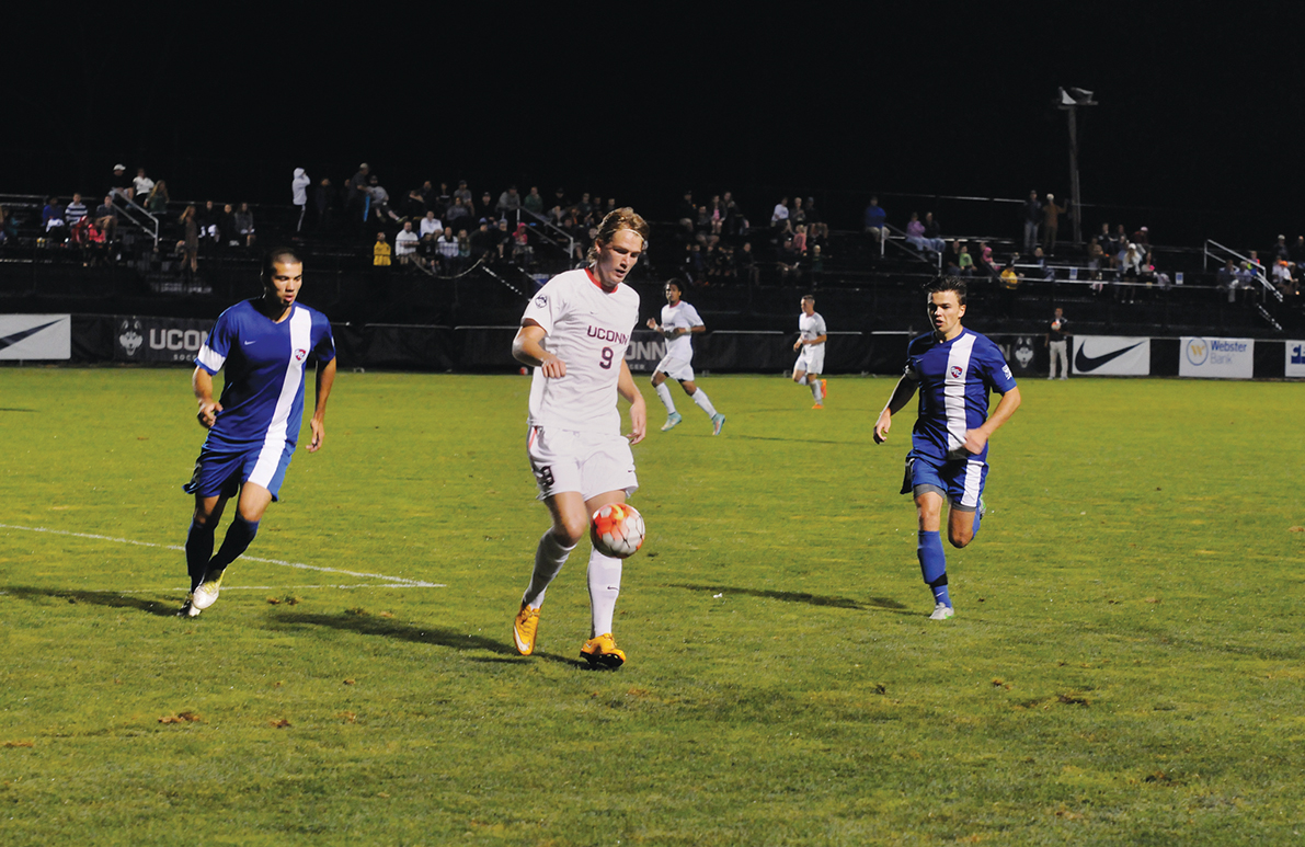 UConn men's soccer forward Fredrik Jonsson brings down the ball during the Huskies' game against St. Francis at Joseph J. Morrone Stadium. (Amar Batra/The Daily Campus)