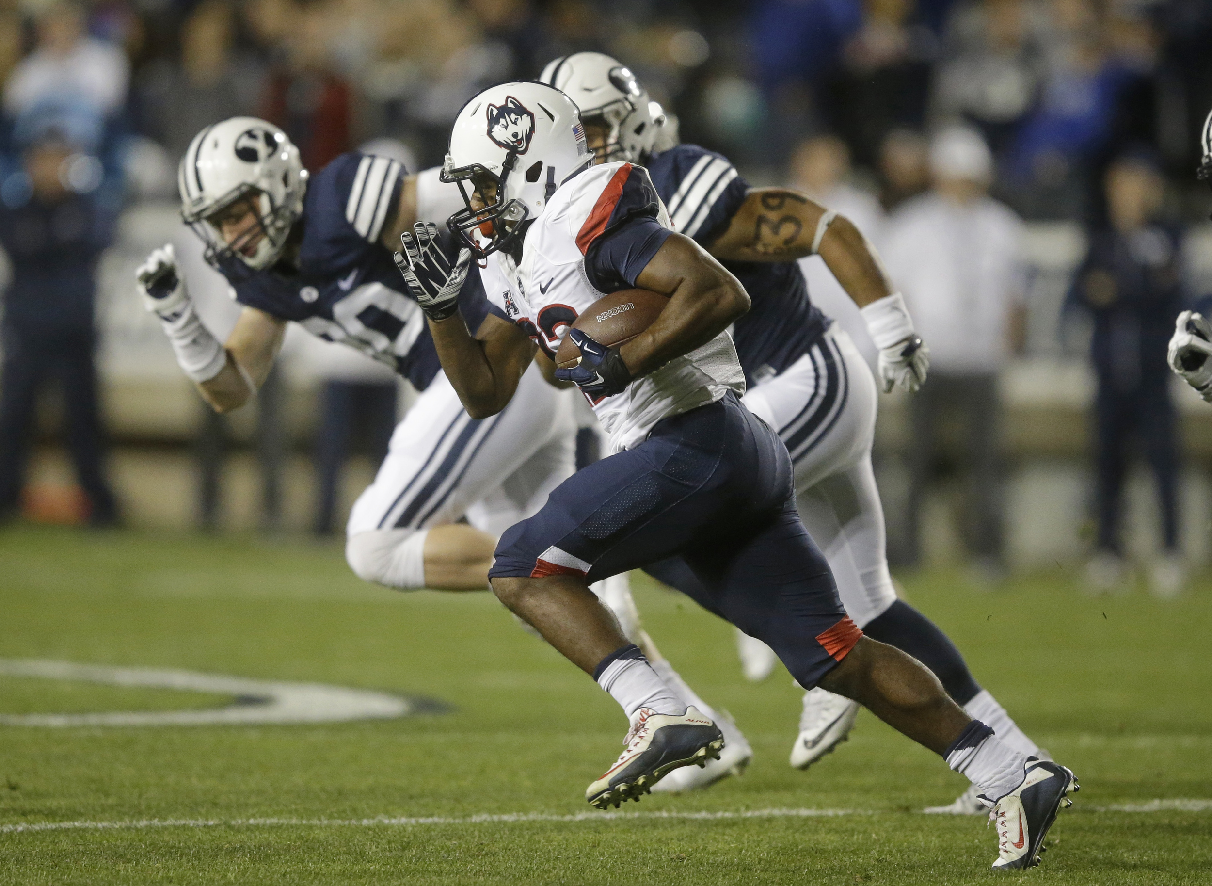 Connecticut running back Arkeel Newsome (22) carries the ball in the first half during an NCAA college football game against BYU Friday, Oct. 2, 2015, in Provo, Utah. (Rick Bowmer/AP)