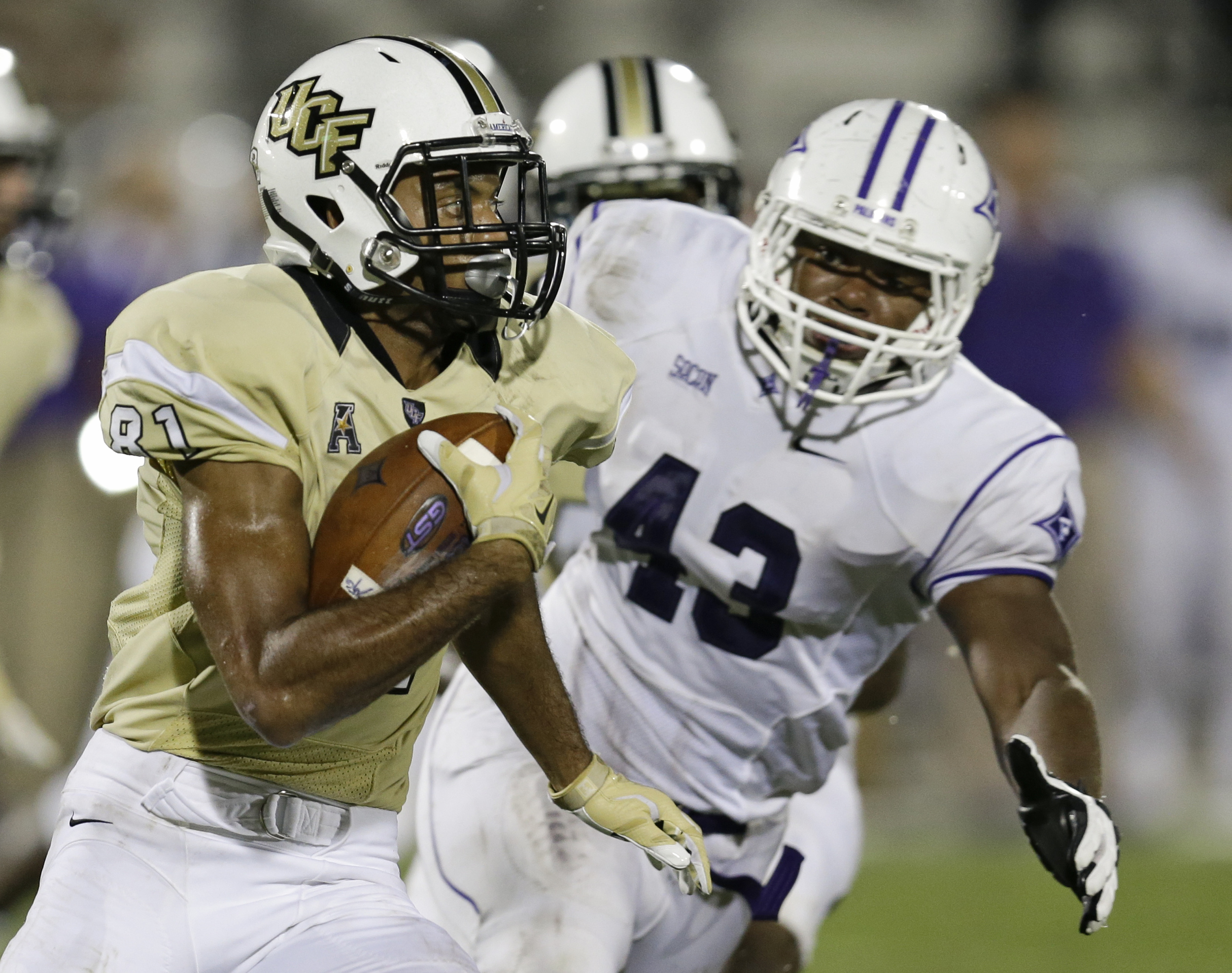 Central Florida wide receiver Chris Johnson (81) runs after a reception as Furman linebacker Brad Minter (43), tries to stop him during the second half an NCAA college football game, Saturday, Sept. 19, 2015, in Orlando, Fla. Furman won 16-15. (John Raoux/AP)