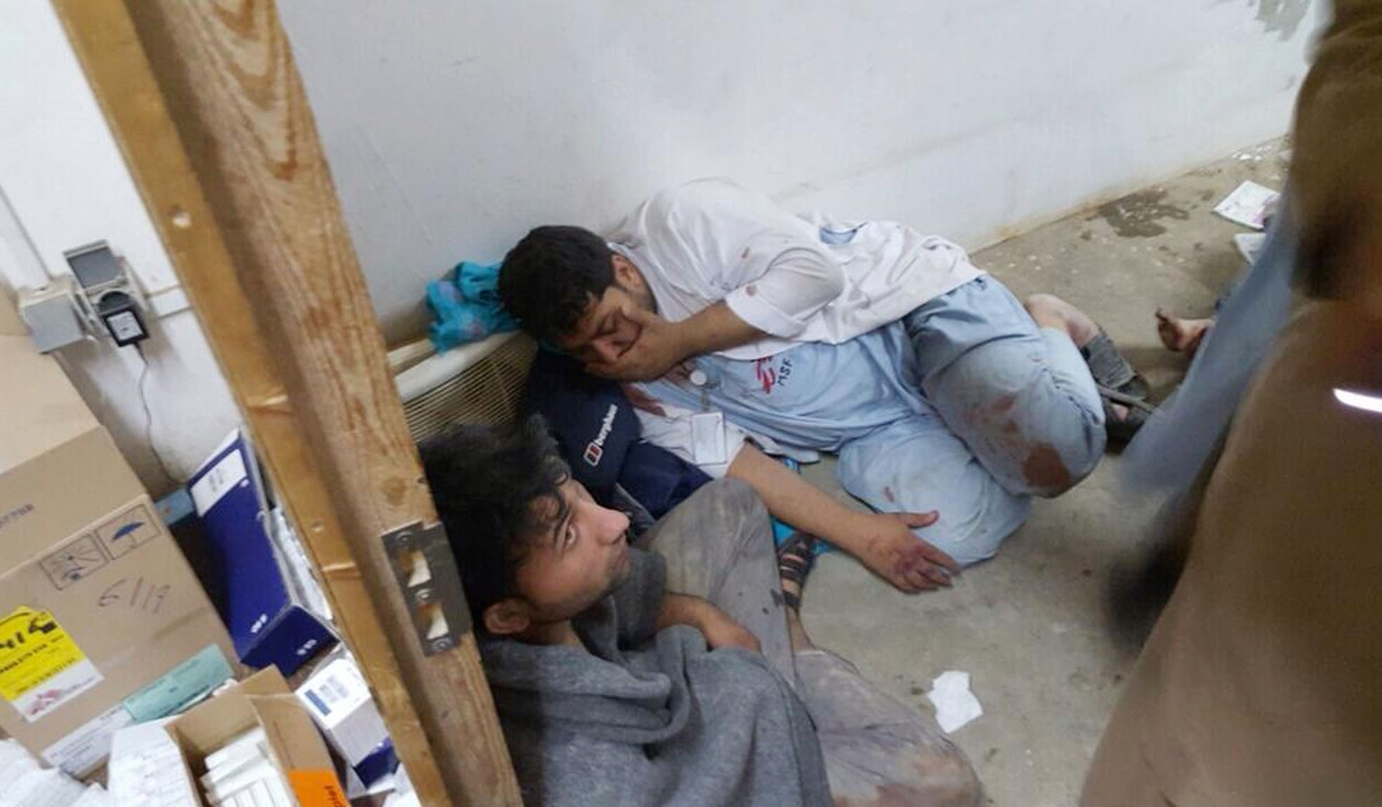 Injured Doctors Without Borders staff are seen after explosions near their hospital in the northern Afghan city of Kunduz, Saturday, Oct. 3, 2015. Doctors Without Borders announced that the death toll from the bombing of the group's Kunduz hospital compound has risen to at least 16, including 3 children and that tens are missing after the explosions that may have been caused by a U.S. airstrike. (Médecins Sans Frontières via AP)