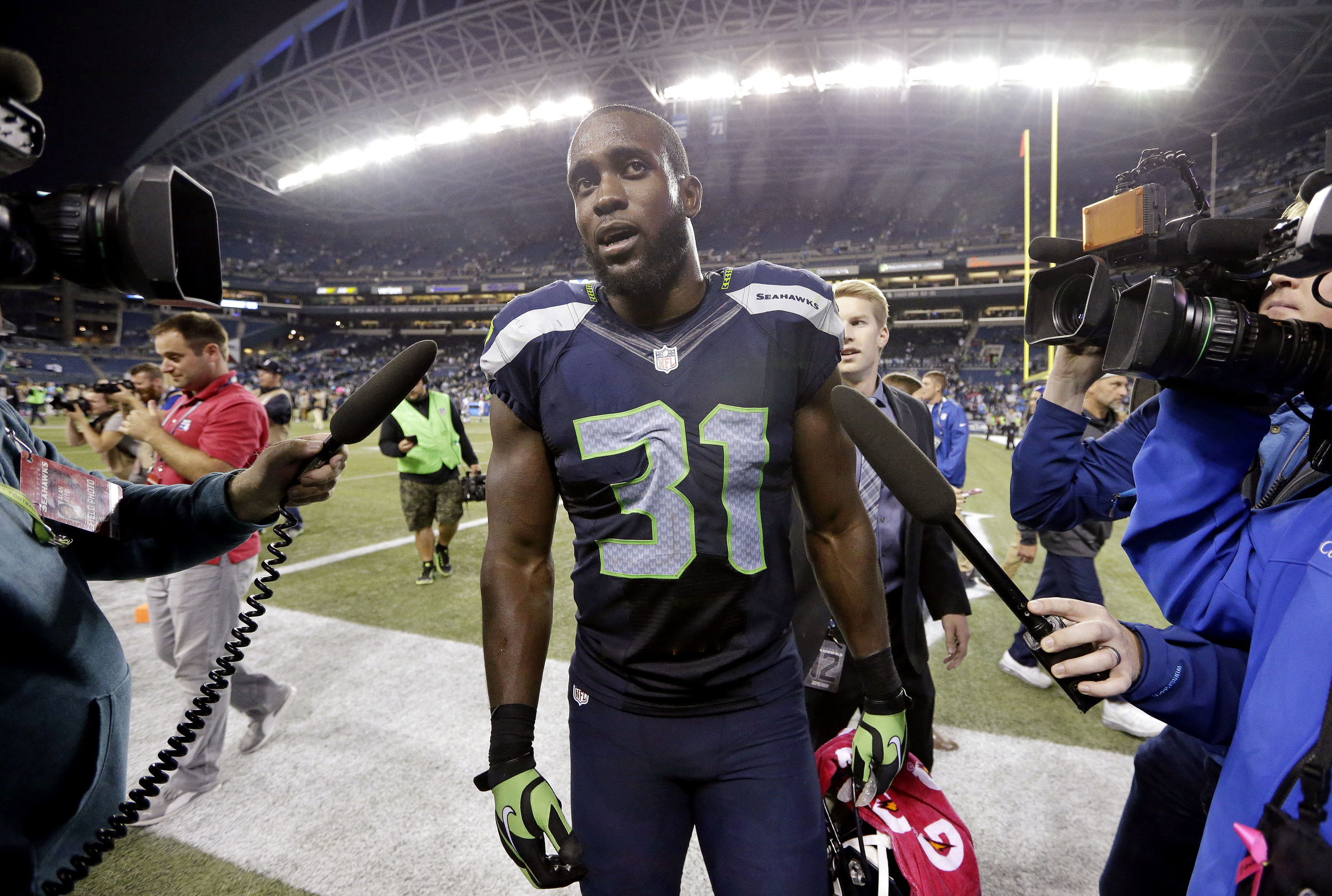 Seattle Seahawks strong safety Kam Chancellor walks off the field after the Seahawks beat the Detroit Lions 13-10 in an NFL football game, Monday, Oct. 5, 2015, in Seattle. (Elaine Thompson/AP)