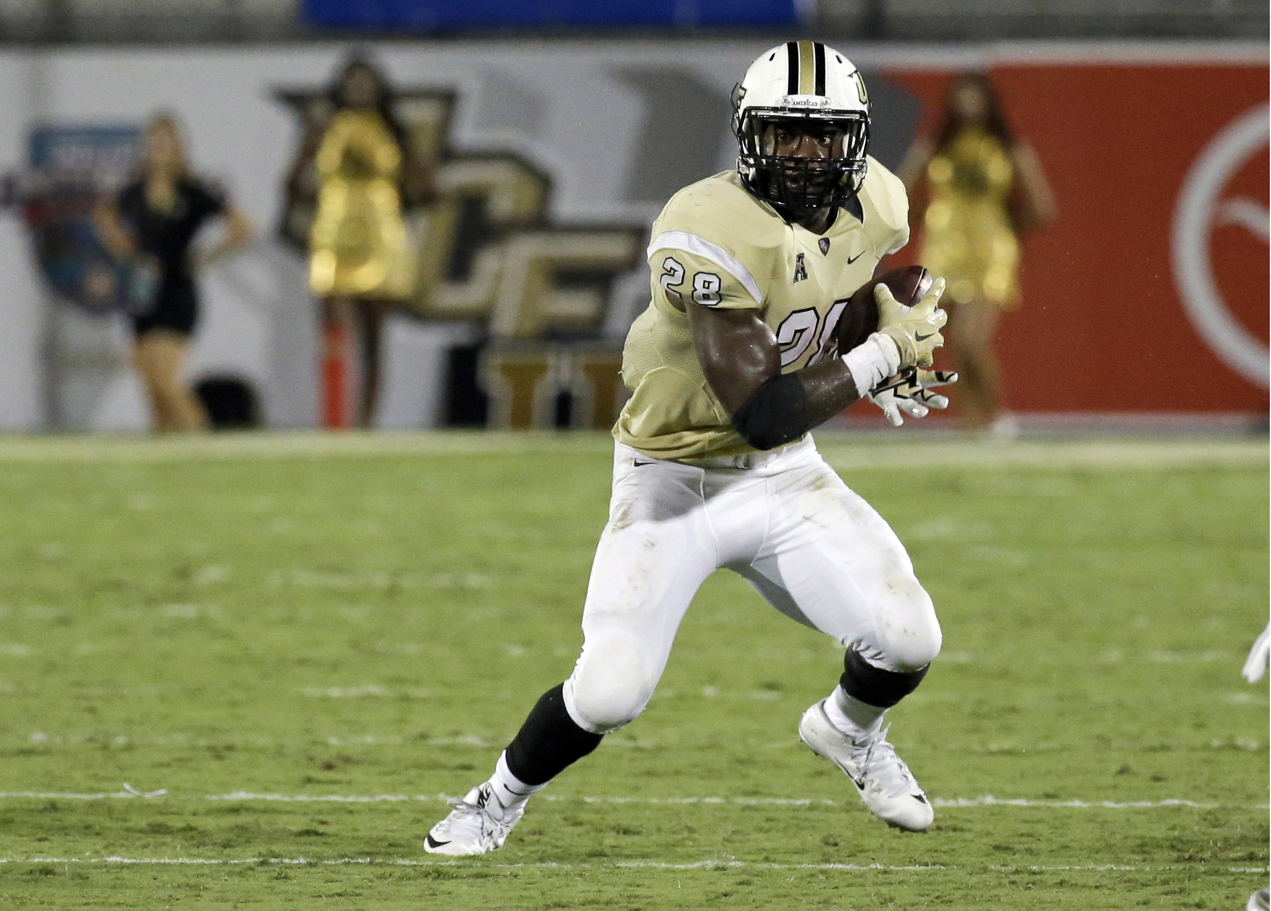 In this Sept. 3, 2015, file photo, Central Florida's William Stanback carries the ball against Florida International during the second half of an NCAA college football game in Orlando, Florida. (John Raoux, File/AP)