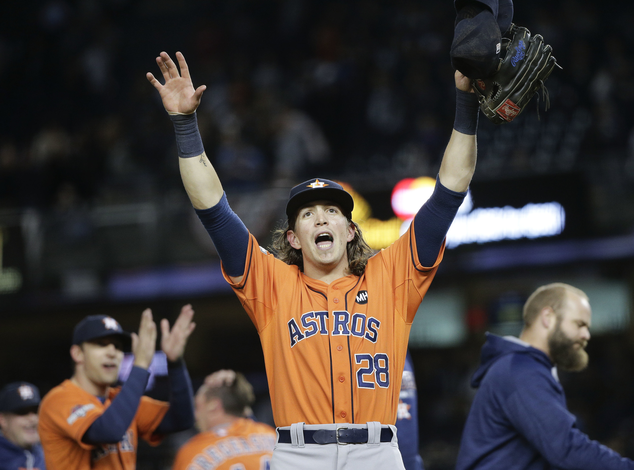 Houston Astros left fielder Colby Rasmus (28) motions to fans after the Astros defeated the New York Yankees 3-0 in the American League wild card baseball game, Tuesday, Oct. 6, 2015, in New York. (Julie Jacobson/AP)