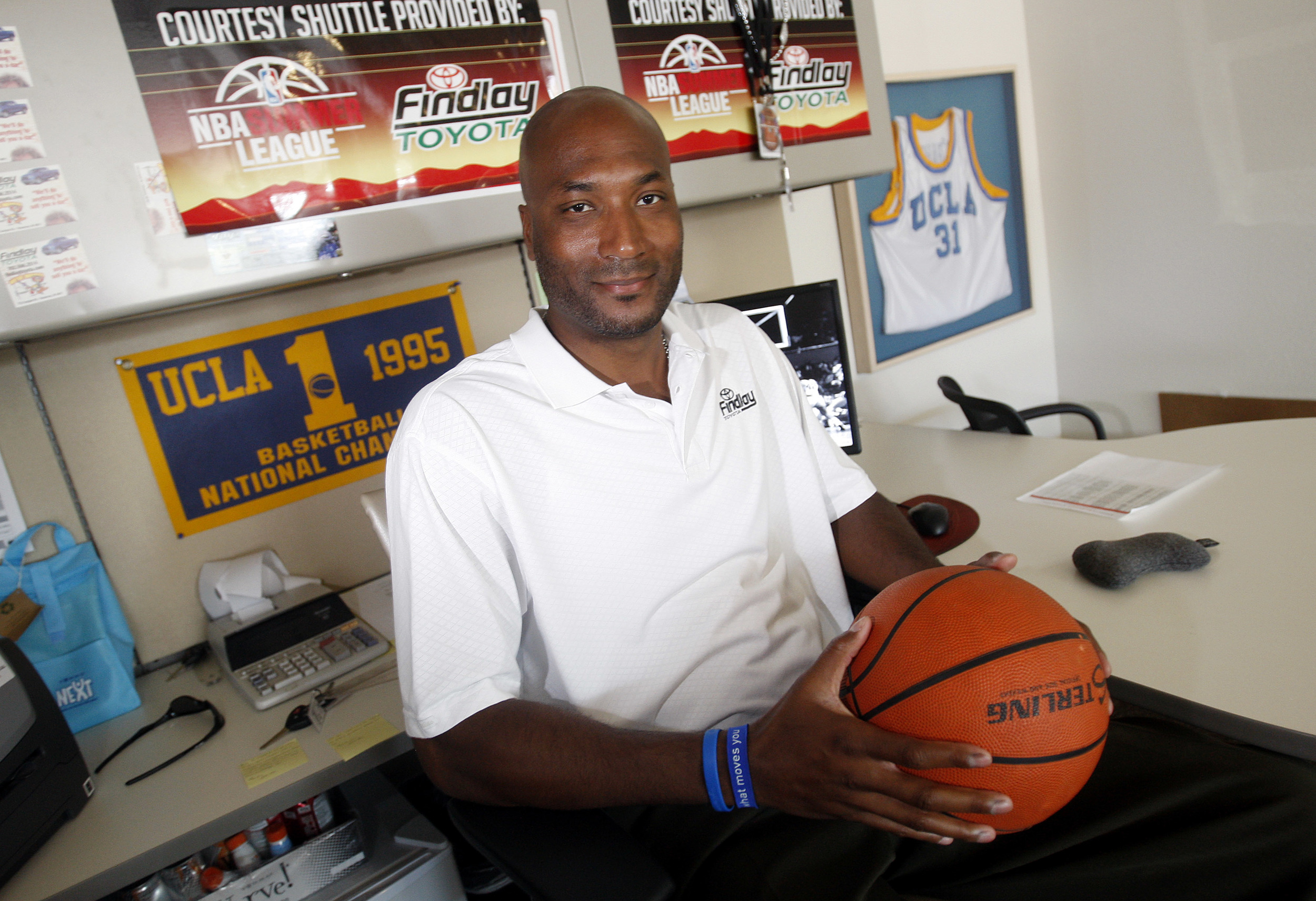 In this Sept. 18, 2010, file photo, former UCLA basketball player Ed O'Bannon Jr. sits in his office in Henderson, Nev. A federal appeals court agreed Wednesday, Sept. 30, 2015, that the NCAA's use of college athletes' names, images and likenesses in video games and TV broadcasts violated antitrust laws but struck down a plan to allow schools to pay players up to $5,000. The decision came in a lawsuit filed by O'Bannon and 19 others. (Isaac Brekken, File/AP)