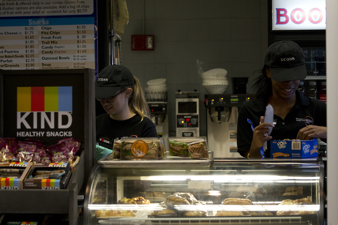 In this photo, two student employees are pictured at the Bookworms Café in UConn's Homer D. Babbidge Library. Almost six weeks into the semester, the cafés are experiencing the worst understaffing Dining Services has ever seen. (Rebecca Newman/The Daily Campus)
