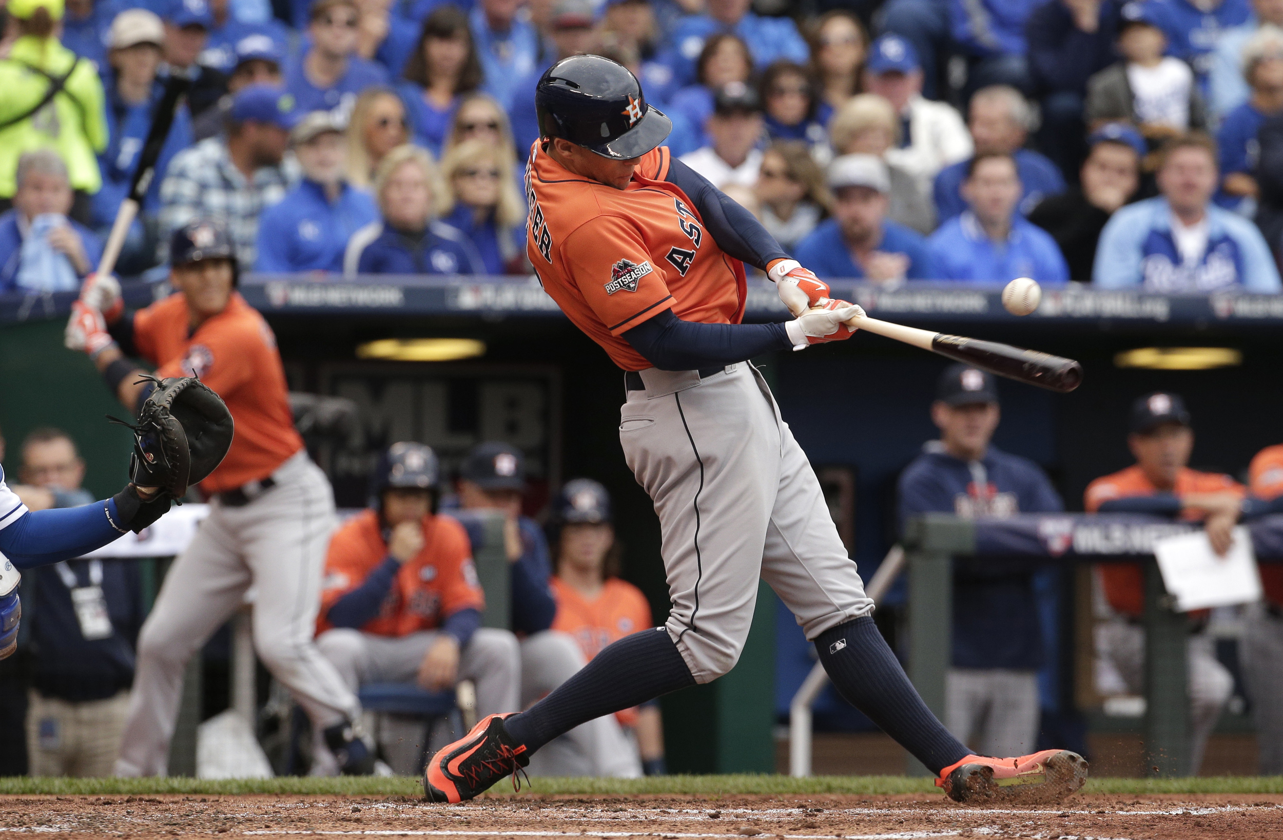 Houston Astros' George Springer hits an RBI-single during the second inning of Game 2 in baseball's American League Division Series against the Kansas City Royals, Friday, Oct. 9, 2015, in Kansas City, Mo. (Charlie Riedel/AP)