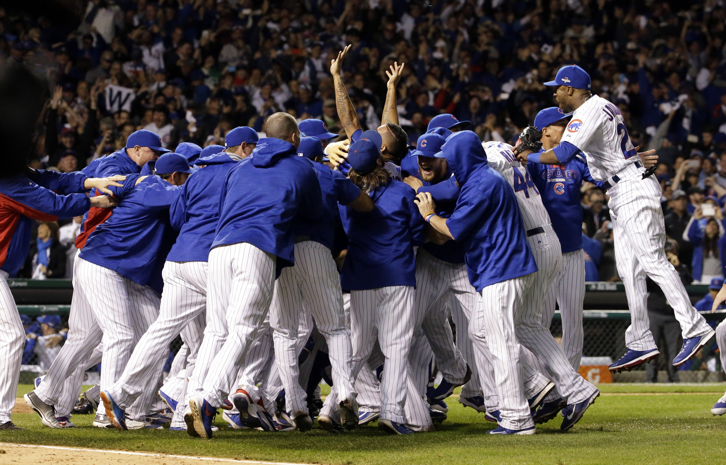 Chicago Cubs players celebrate after winning Game 4 in baseball's National League Division Series, Tuesday, Oct. 13, 2015, in Chicago. The Cubs won 4-6. (Nam Y. Huh/AP)