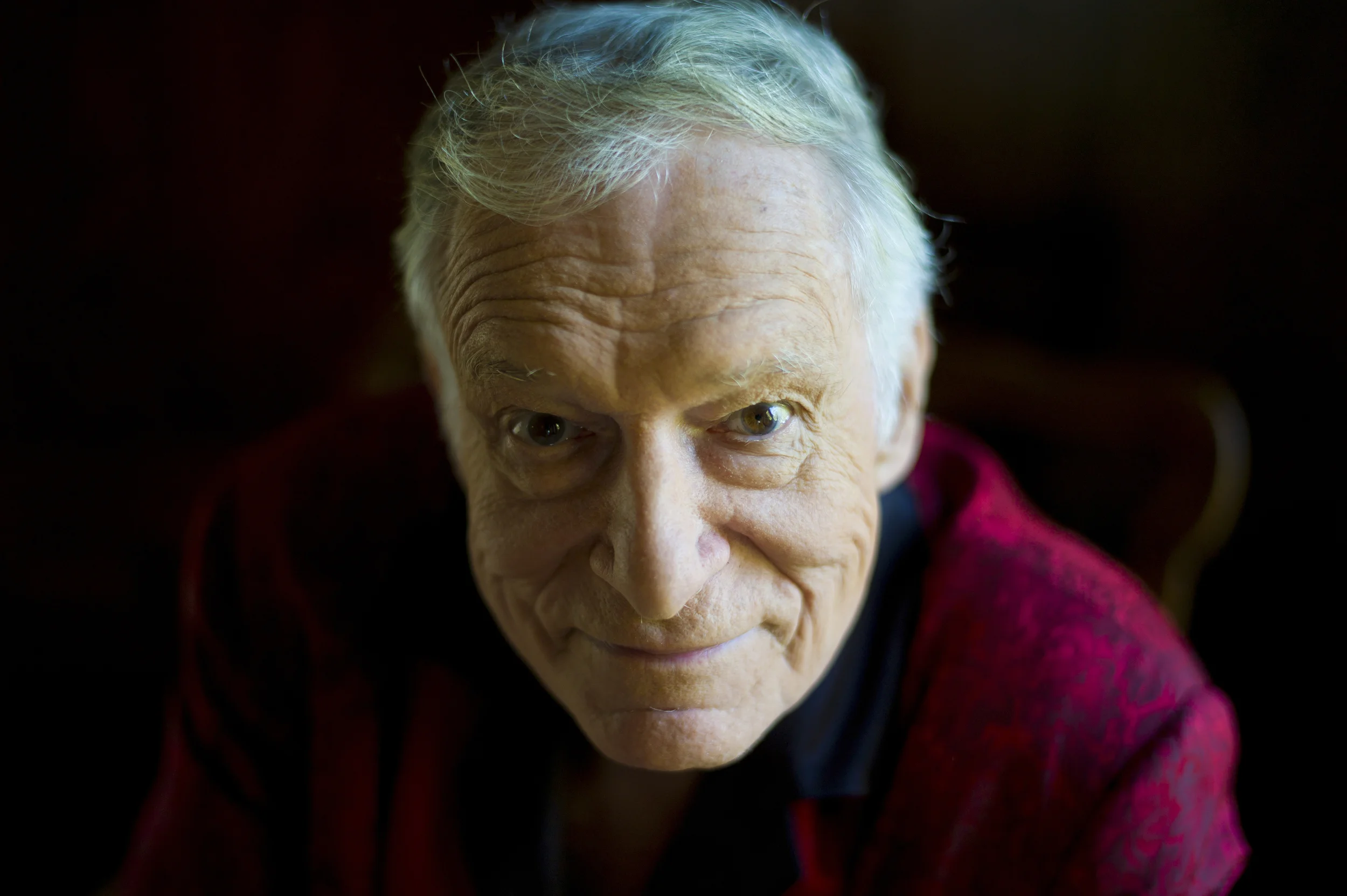In this Oct. 13, 2011 file photo, American magazine publisher, founder and Chief Creative Officer of Playboy Enterprises, Hugh Hefner at his home (aka Playboy Mansion) in Beverly Hills, Calif. Playboy will no longer publish photos of nude women as part of a redesign of the decades-old magazine, according to a news report Monday, Oct. 12, 2015. (Kristian Dowling, File/AP)