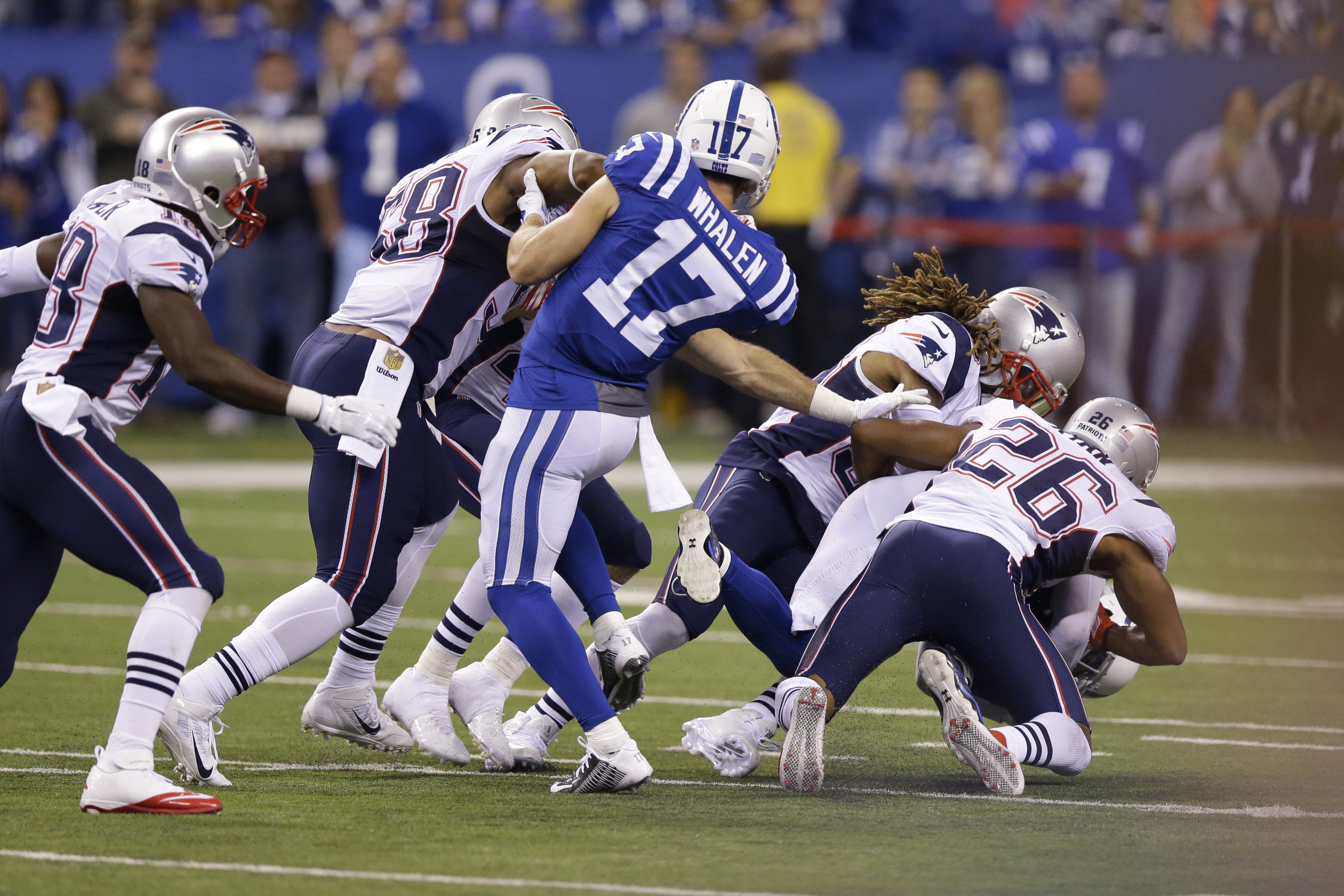 In this Oct. 18, 2015, file photo, Indianapolis Colts wide receiver Griff Whalen (17) watches as Colts free safety Colt Anderson (32) is tackled by New England Patriots running back James White (28) on a fake punt in the second half of an NFL football game in Indianapolis. (AJ Mast/AP)