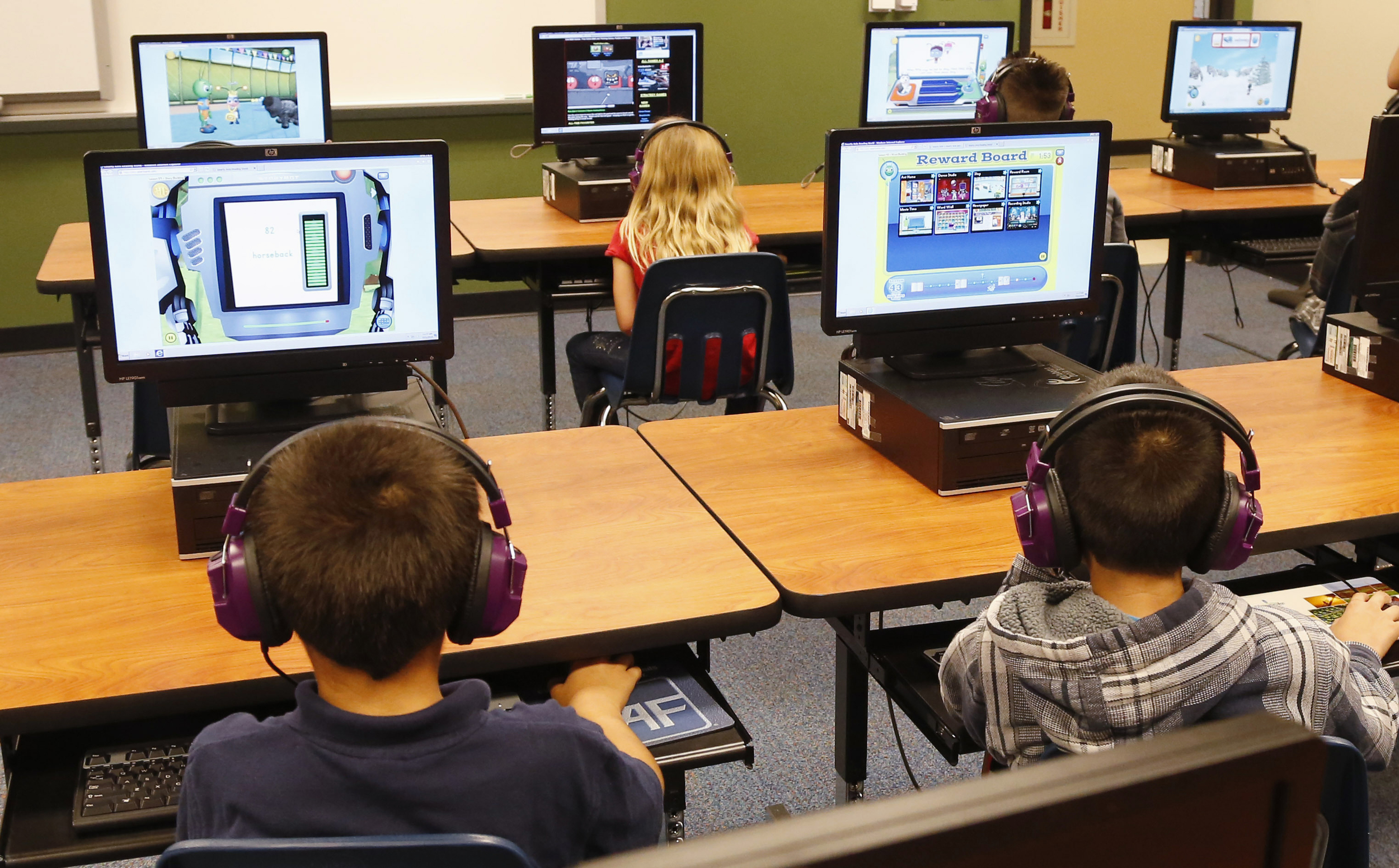 In this July 21, 2014 file photo, students at a summer reading academy at Buchanan elementary school work in the computer lab at the school in Oklahoma City. Wading into one of the most polarizing issues in education, President Barack Obama called Saturday for capping standardized testing at 2 percent of classroom time, while conceding the government shares responsibility for having turned tests into the be-all-and-end-all of American schools. (Sue Ogrocki, File/AP)