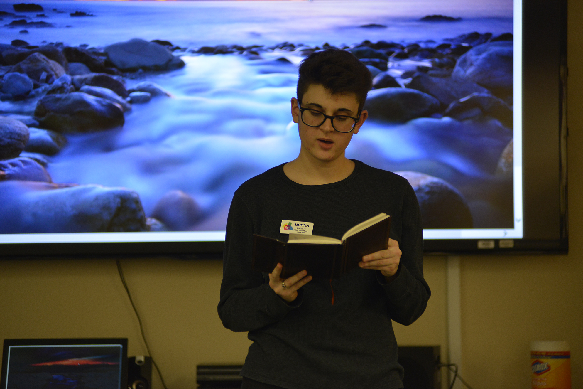 A student reads poetry during a Rainbow Center event in the Student Union on Friday, Oct. 23, 2015. theme was spoken word poetry and it began with a poetry workshop, which transitioned into an open-mic. (Jason Jiang/The Daily Campus)