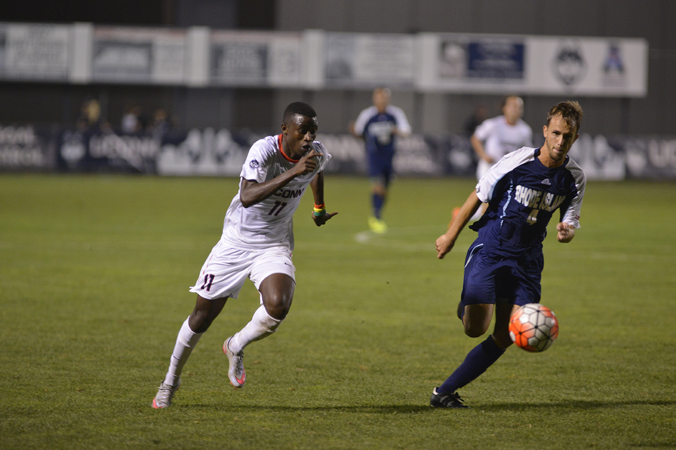UConn freshman forward Abdou Mbacke Thiam fights for the ball during the Huskies' game against the Rams at Joseph J. Morrone Stadium in Storrs, Connecticut on Saturday, Sept. 19, 2015. Thiam's game-tying goal with one-second left in regulation helped the Huskies secure a draw Saturday against Tulsa. (Jason Jiang/The Daily Campus)