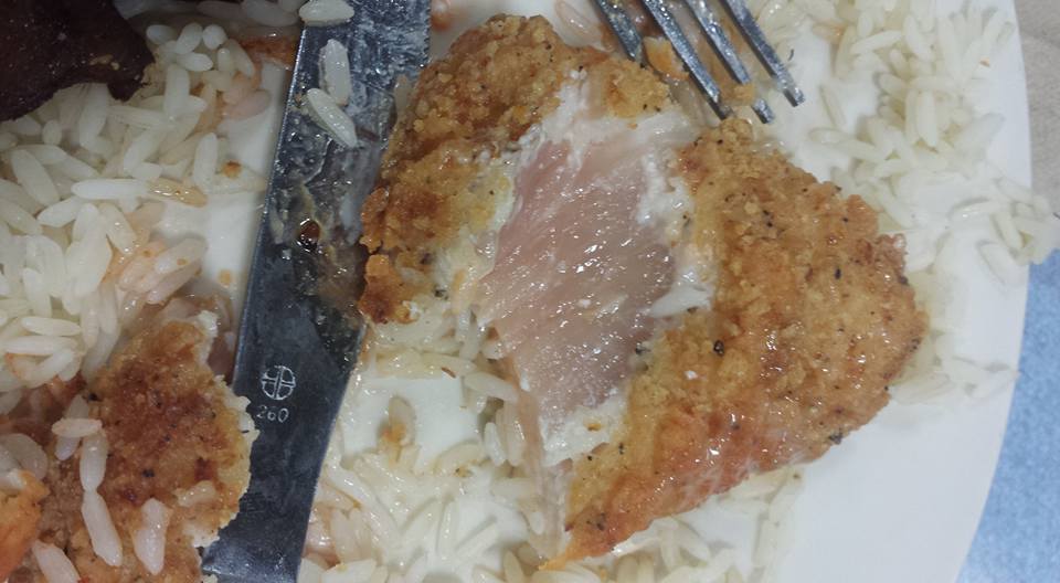 In this photo, a raw piece of breaded chicken is seen on fifth-semester marketing major Matthew Davidson's plate at North Dining Hall on Monday, Oct. 26, 2015. (Courtesy/Matthew Davidson)
