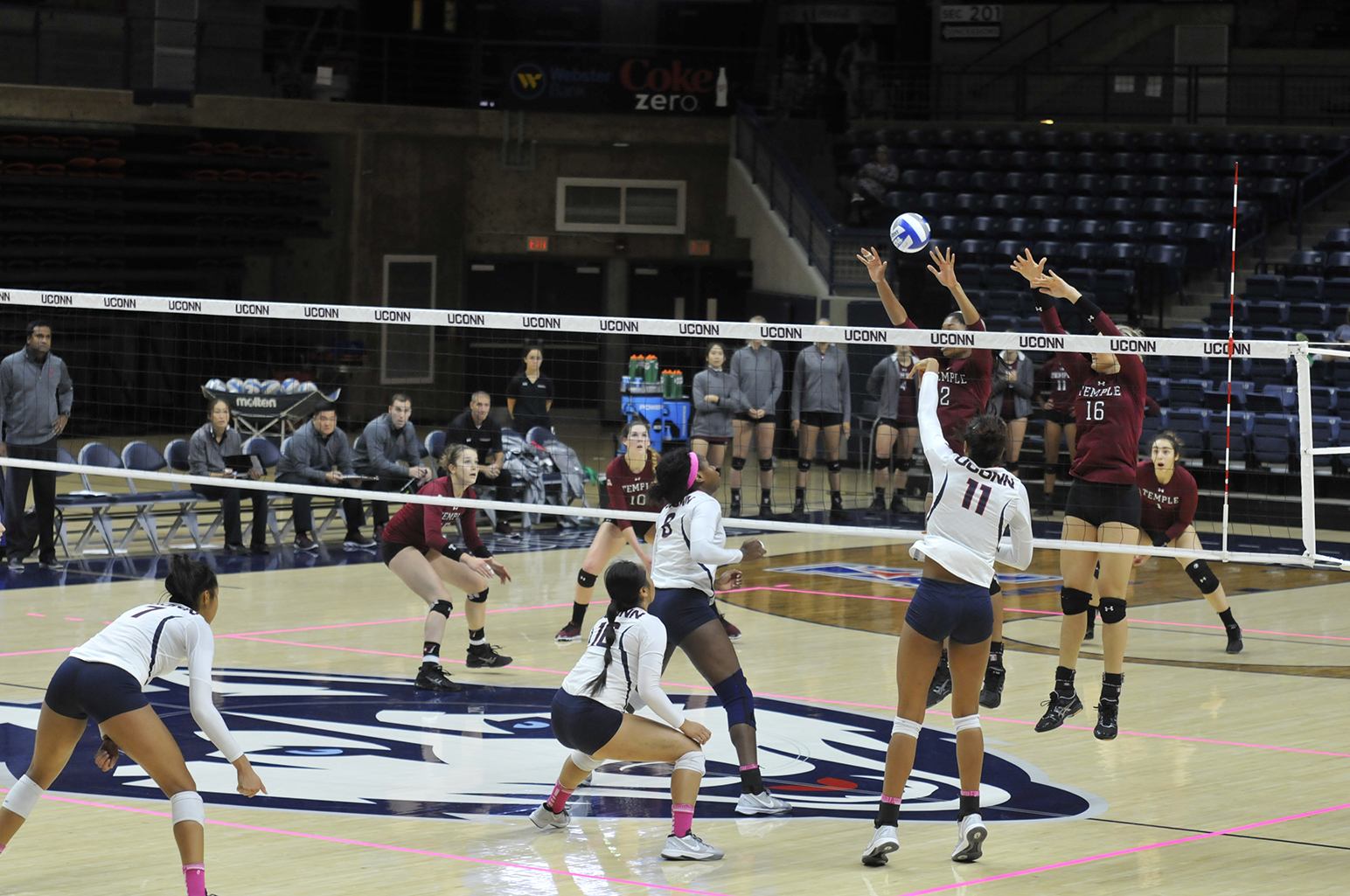 Senior Erika Thomas (11) attempts a block during UConn's 3-2 victory over Temple on October 14th, 2015. The Huskies will travel to Memphis and Cincinnati this weekend. (Amar Batra/The Daily Campus)